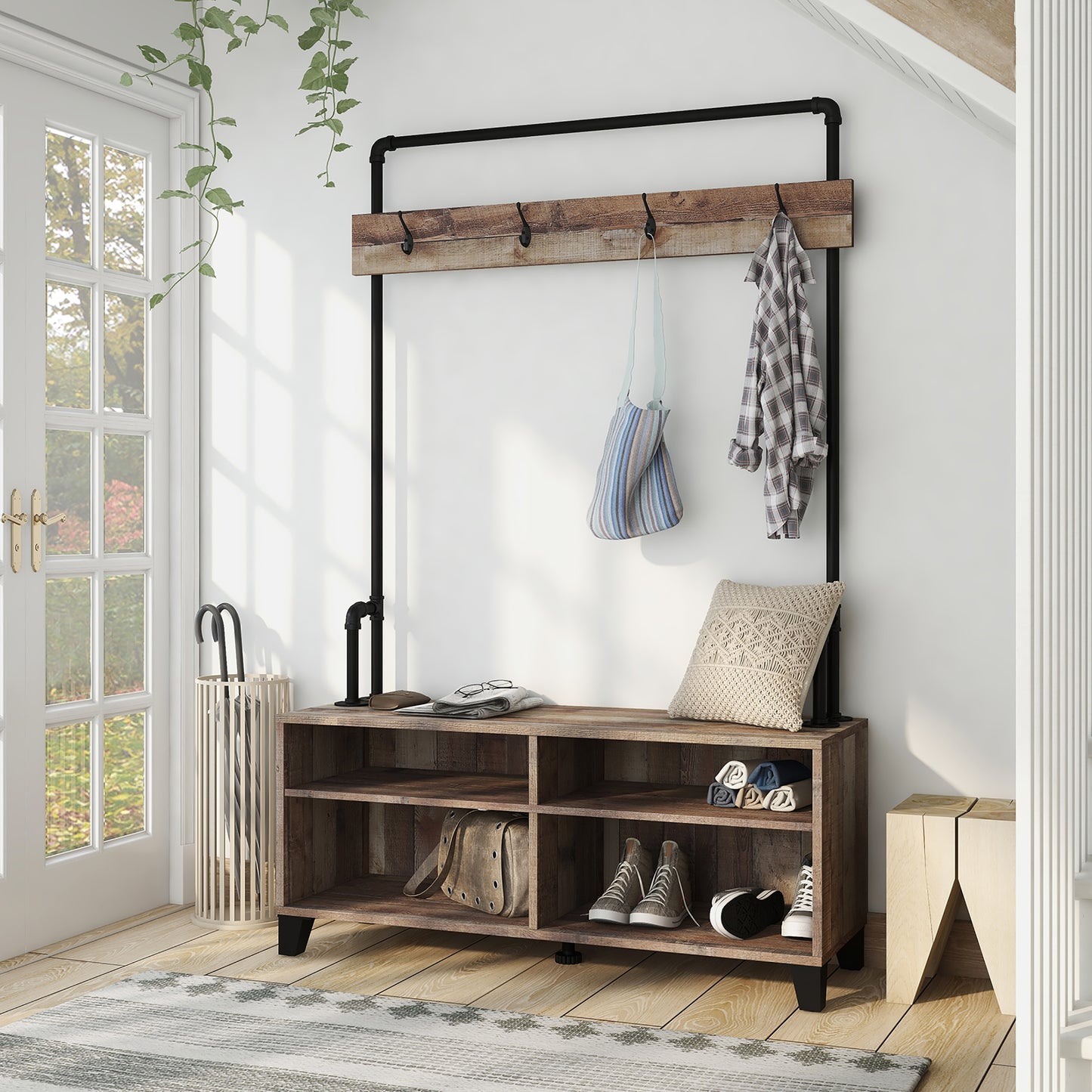 Left angled industrial reclaimed barnwood water pipe four-shelf entryway coat rack bench in an entry with accessories