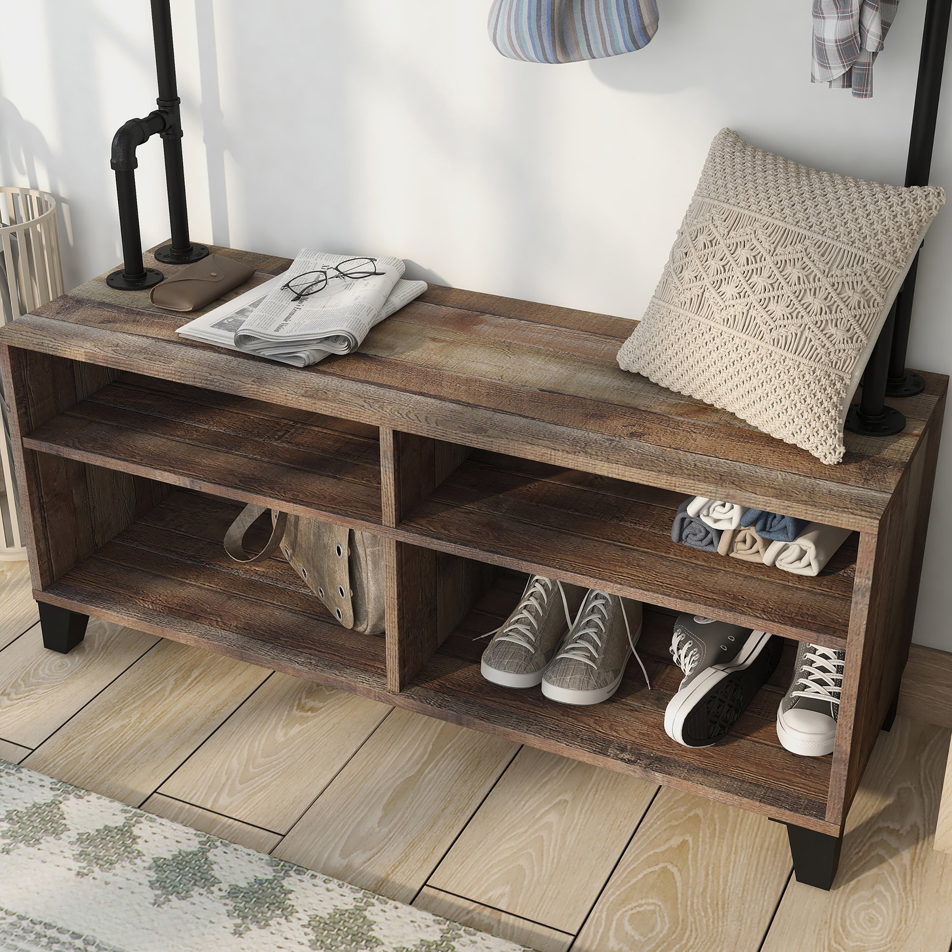 Left angled close-up view of an industrial reclaimed barnwood water pipe four-shelf entryway coat rack bench in an entry with accessories