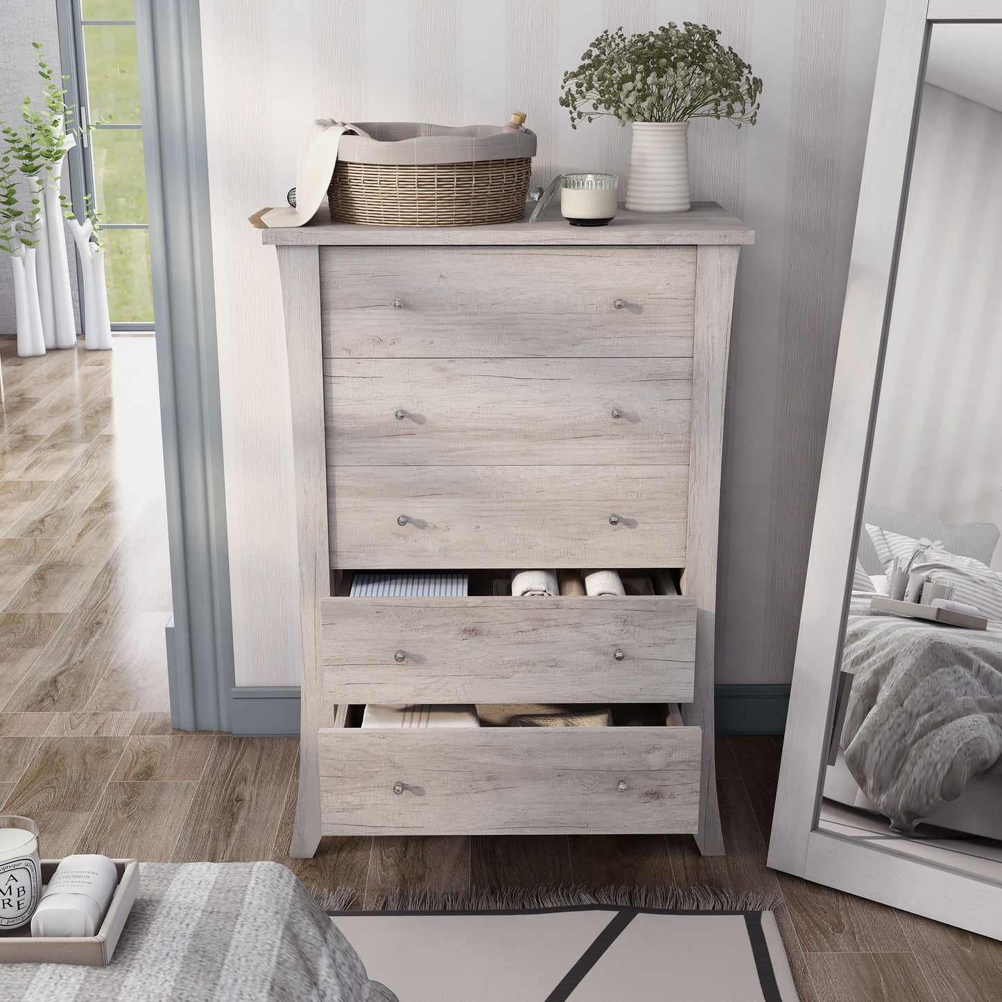 Front-facing transitional coastal white five-drawer chest in a living area with two drawers open with accessories