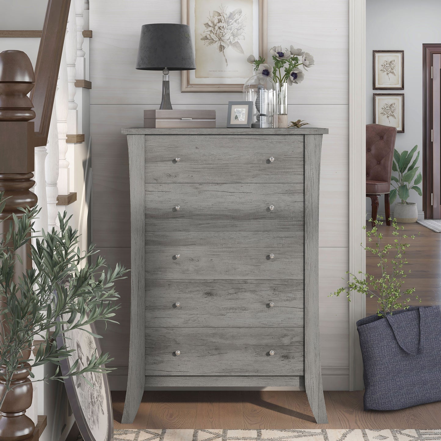 Front-facing transitional vintage gray oak five-drawer chest in a living area with accessories