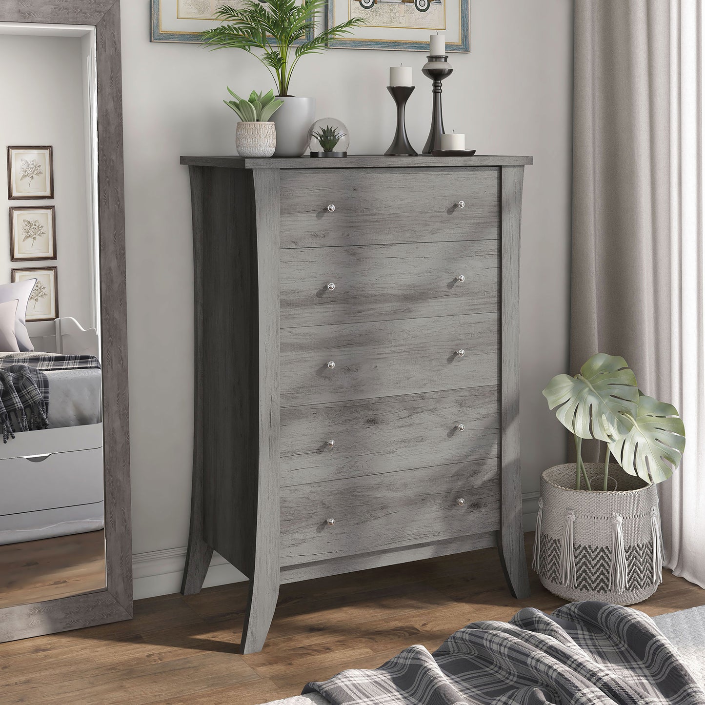 Right angled transitional vintage gray oak five-drawer chest in a bedroom with accessories