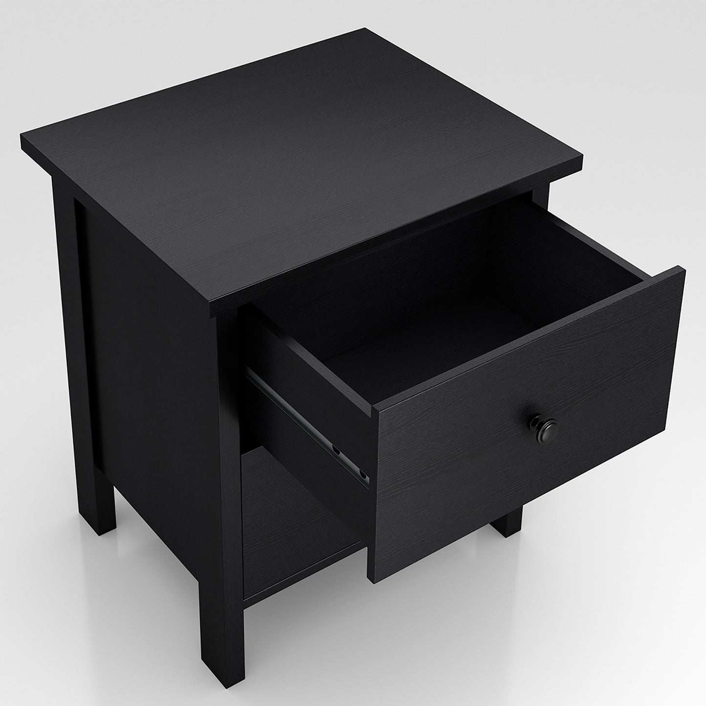 Right angled upper view of a transitional black two-drawer nightstand with top drawer open on a white background