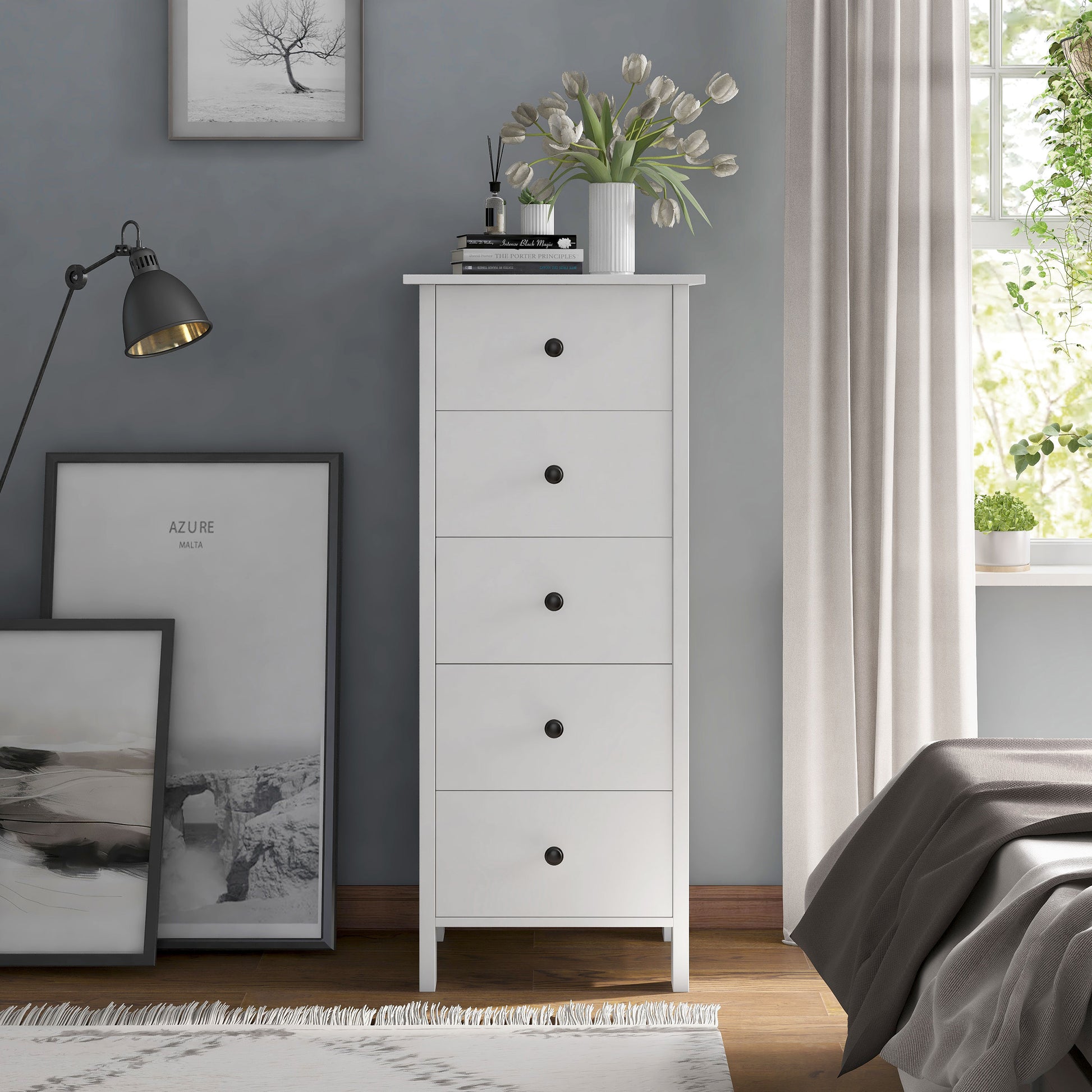Front-facing transitional white slim five-drawer chest in a bedroom with accessories