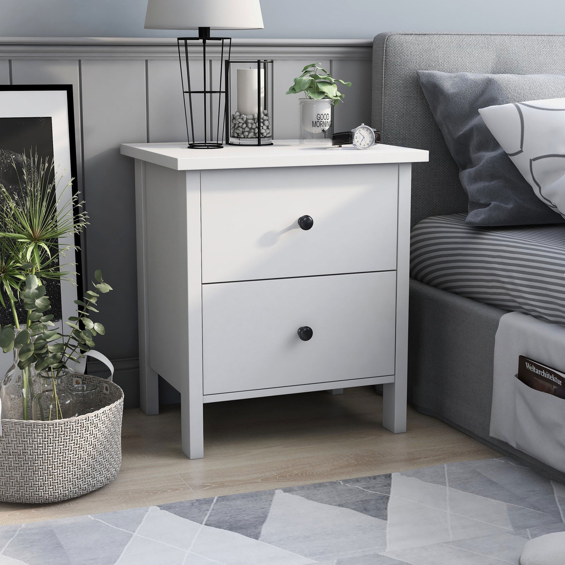 Right angled transitional white two-drawer nightstand in a bedroom with accessories