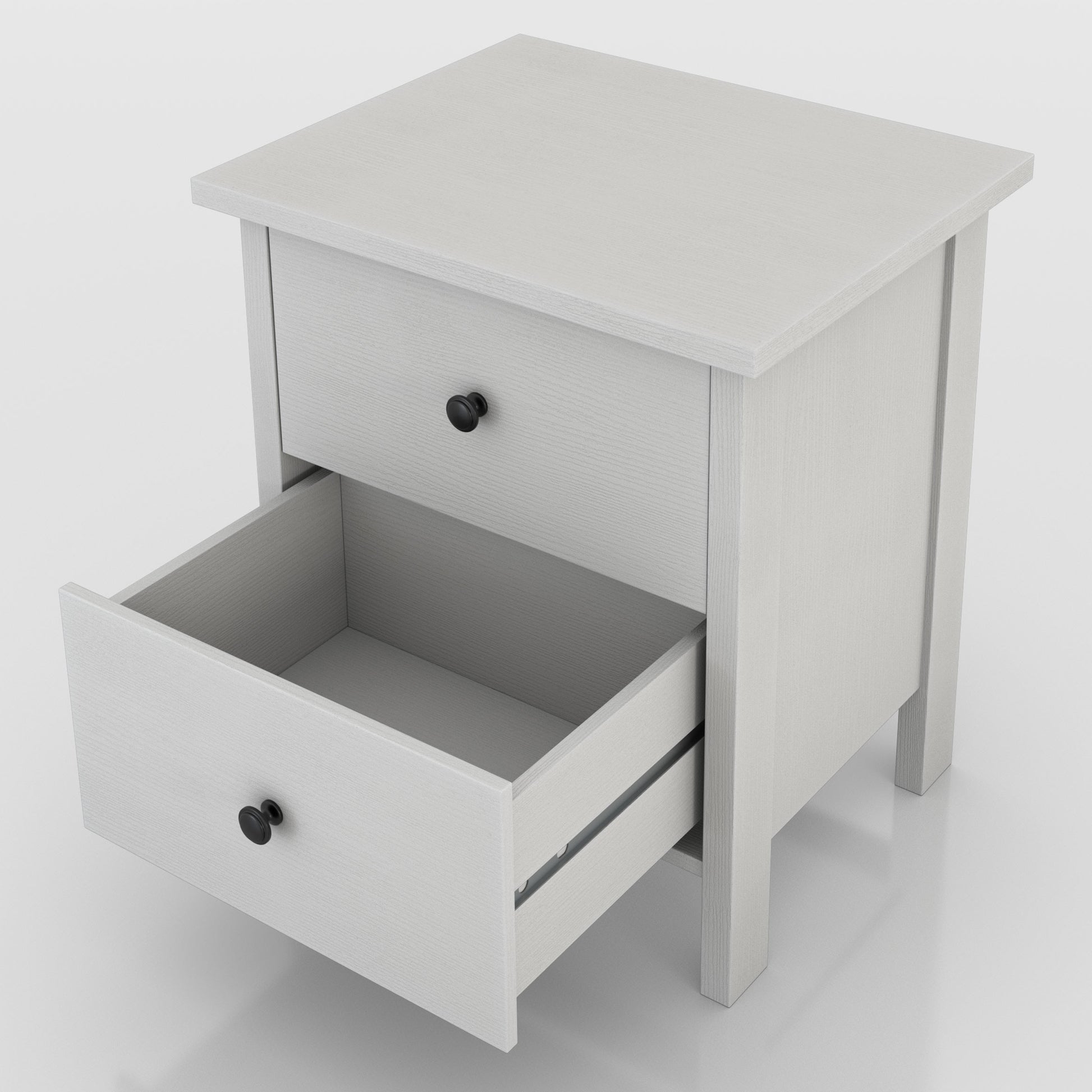 Left angled upper view of a transitional white two-drawer nightstand with bottom drawer open on a white background