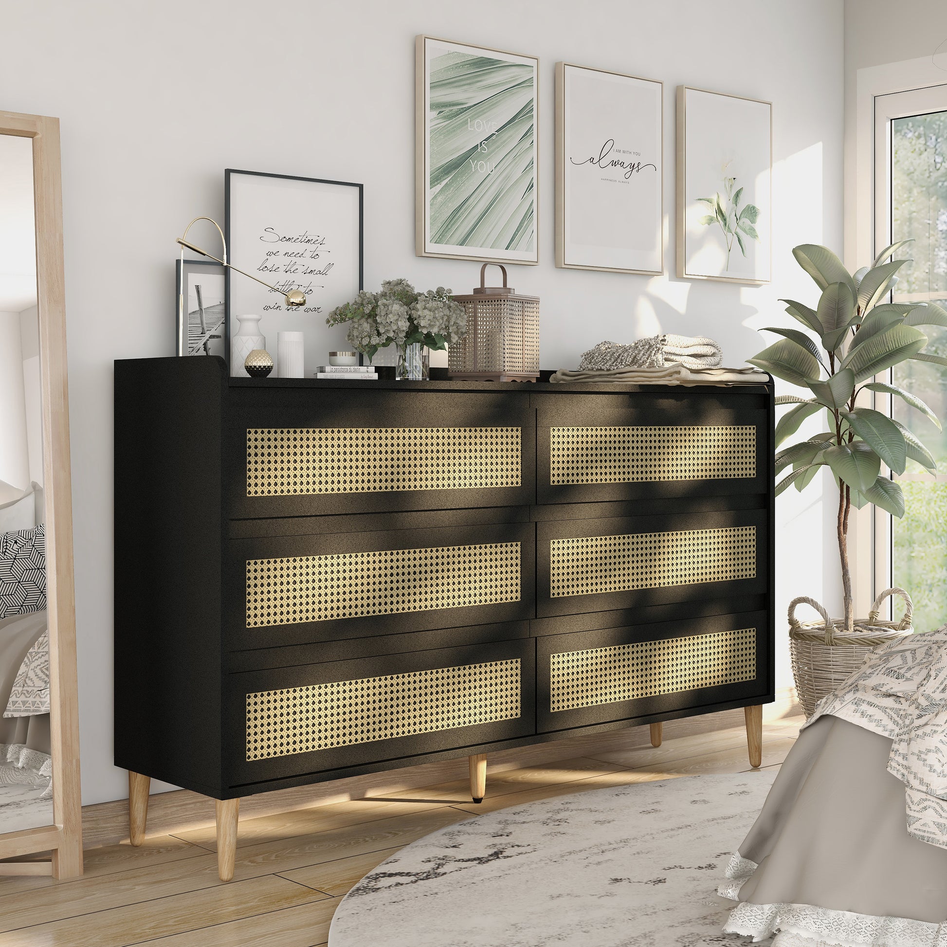 Right angled mid-century modern black and rattan six-drawer dresser in a bedroom with accessories