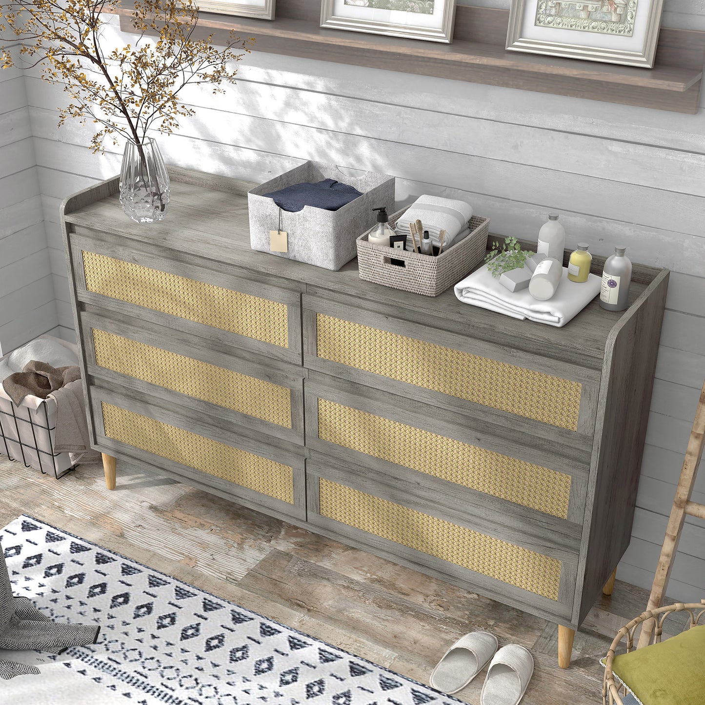 Left angled bird's eye view of a mid-century modern vintage gray oak and rattan six-drawer dresser in a bedroom with accessories