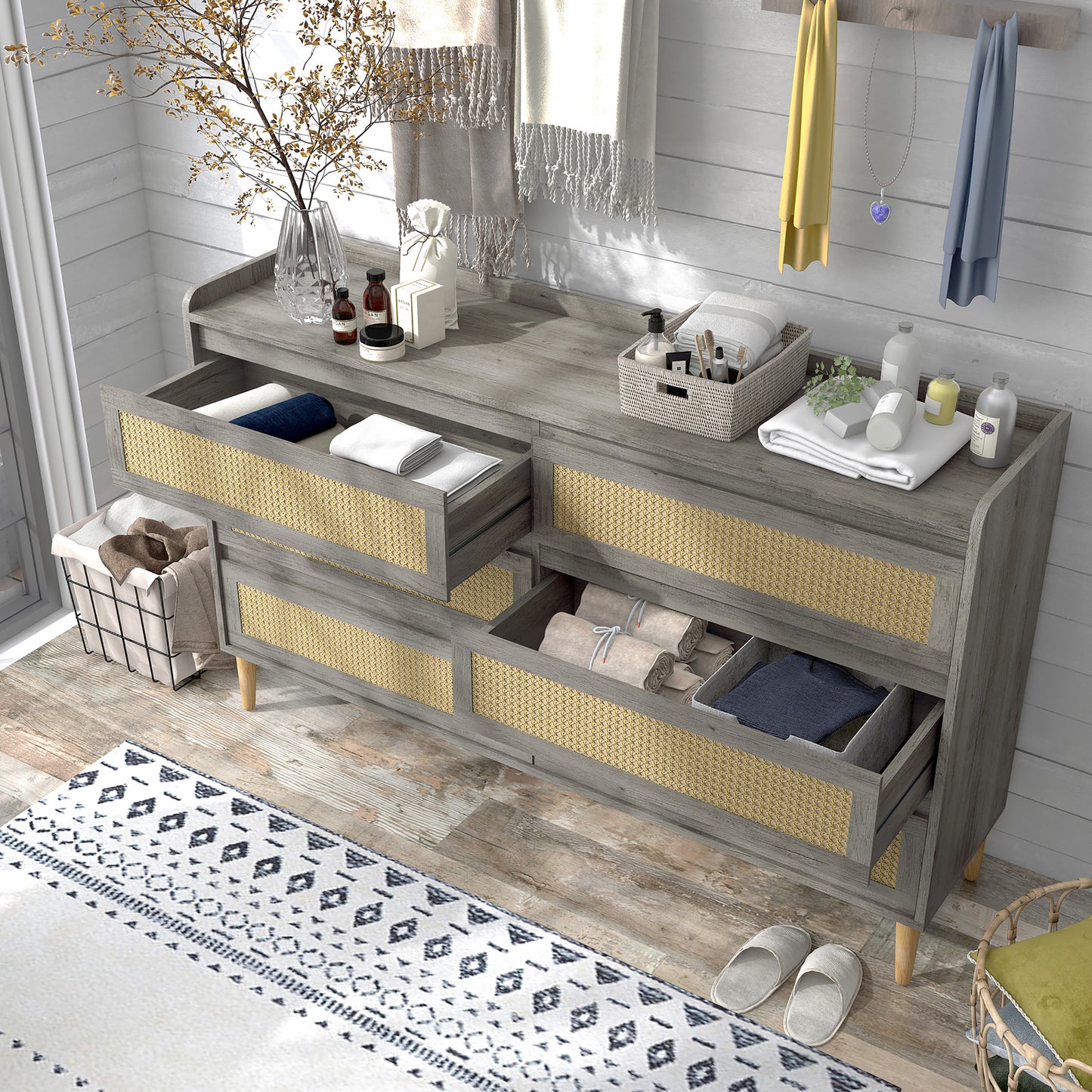 Left angled bird's eye view of a mid-century modern vintage gray oak and rattan six-drawer dresser with two drawers open in a bedroom with accessories