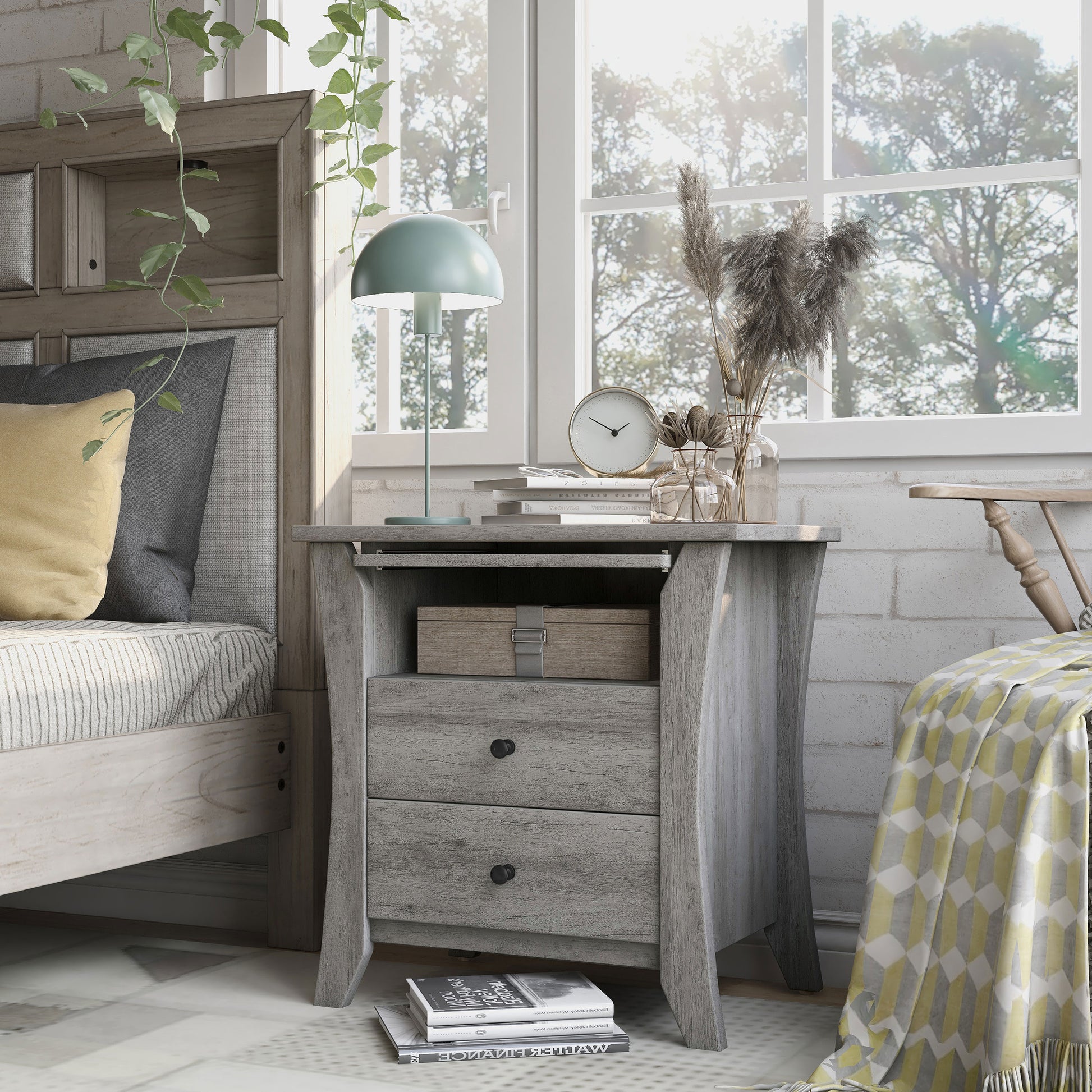 Left angled transitional vintage gray oak two-drawer one-shelf nightstand in a bedroom with accessories