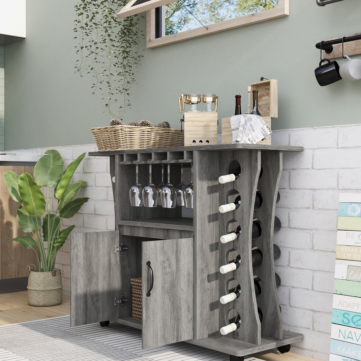 Left angled transitional vintage gray oak two-door mobile bar table with bottle and stemware racks and doors open in a dining room with accessories