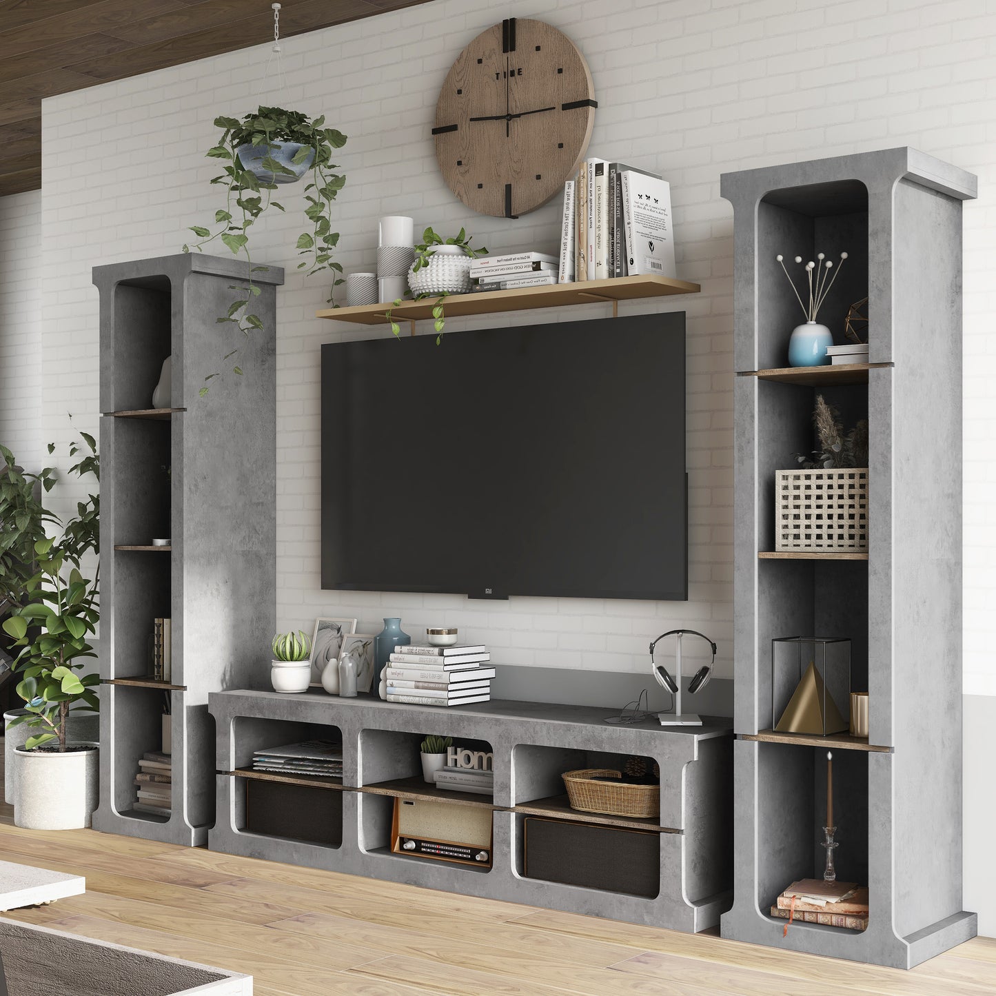 Left angled industrial cement and wood three-piece TV stand and media tower set in a living area with accessories