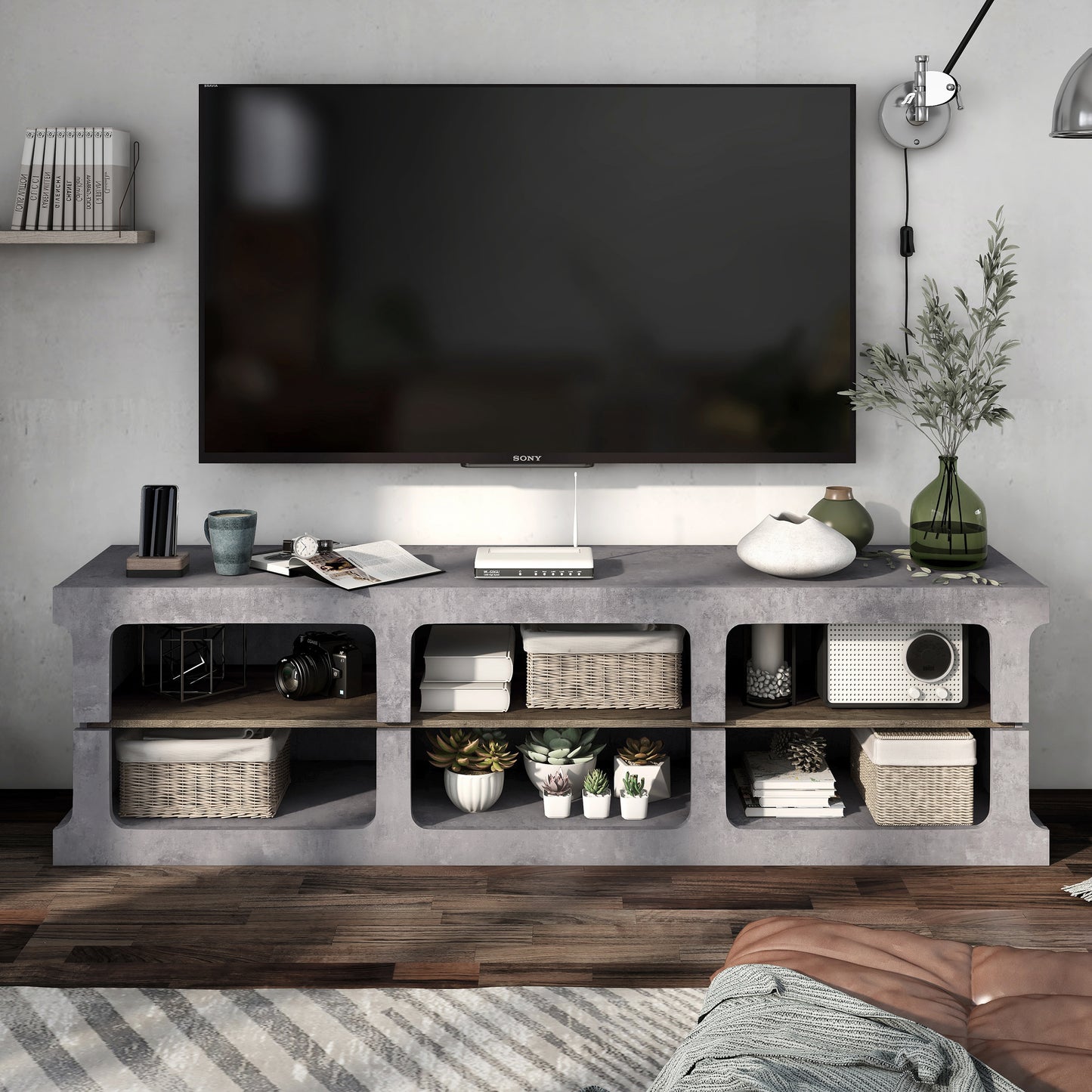 Front-facing industrial cement and wood six-shelf TV stand in a living area with accessories
