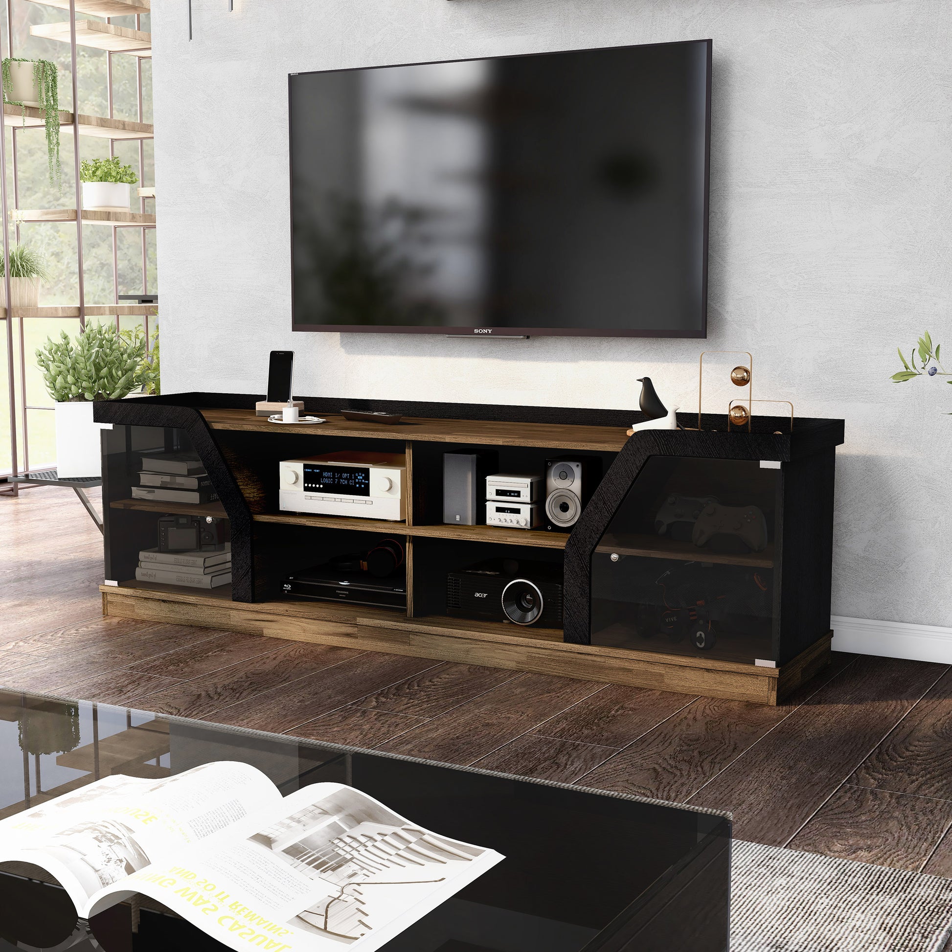 Left angled contemporary light hickory and black glass multi-shelf TV console in a living room with accessories