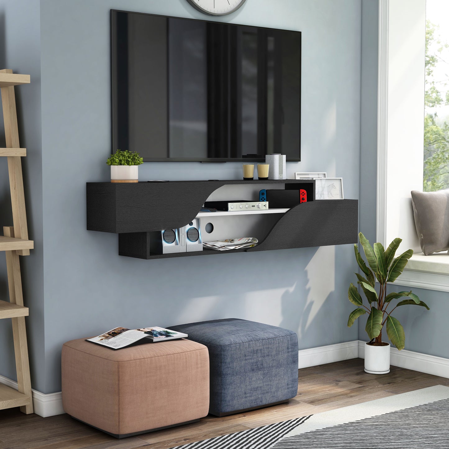 Right angled transitional black and white two-shelf floating TV stand in a living room with accessories