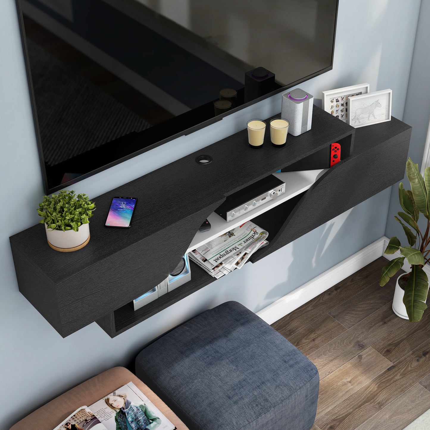 Right angled bird's eye view of a transitional black and white two-shelf floating TV stand in a living room with accessories