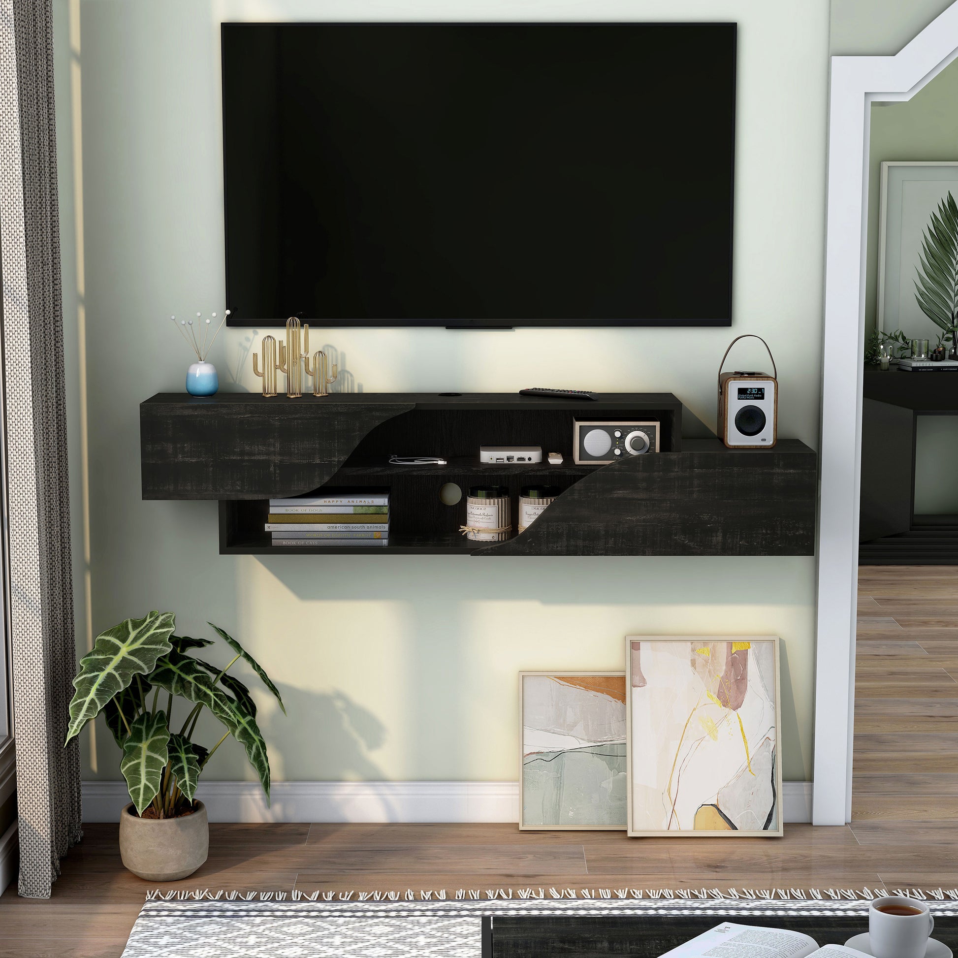 Front-facing transitional reclaimed black two-shelf floating TV stand in a living room with accessories