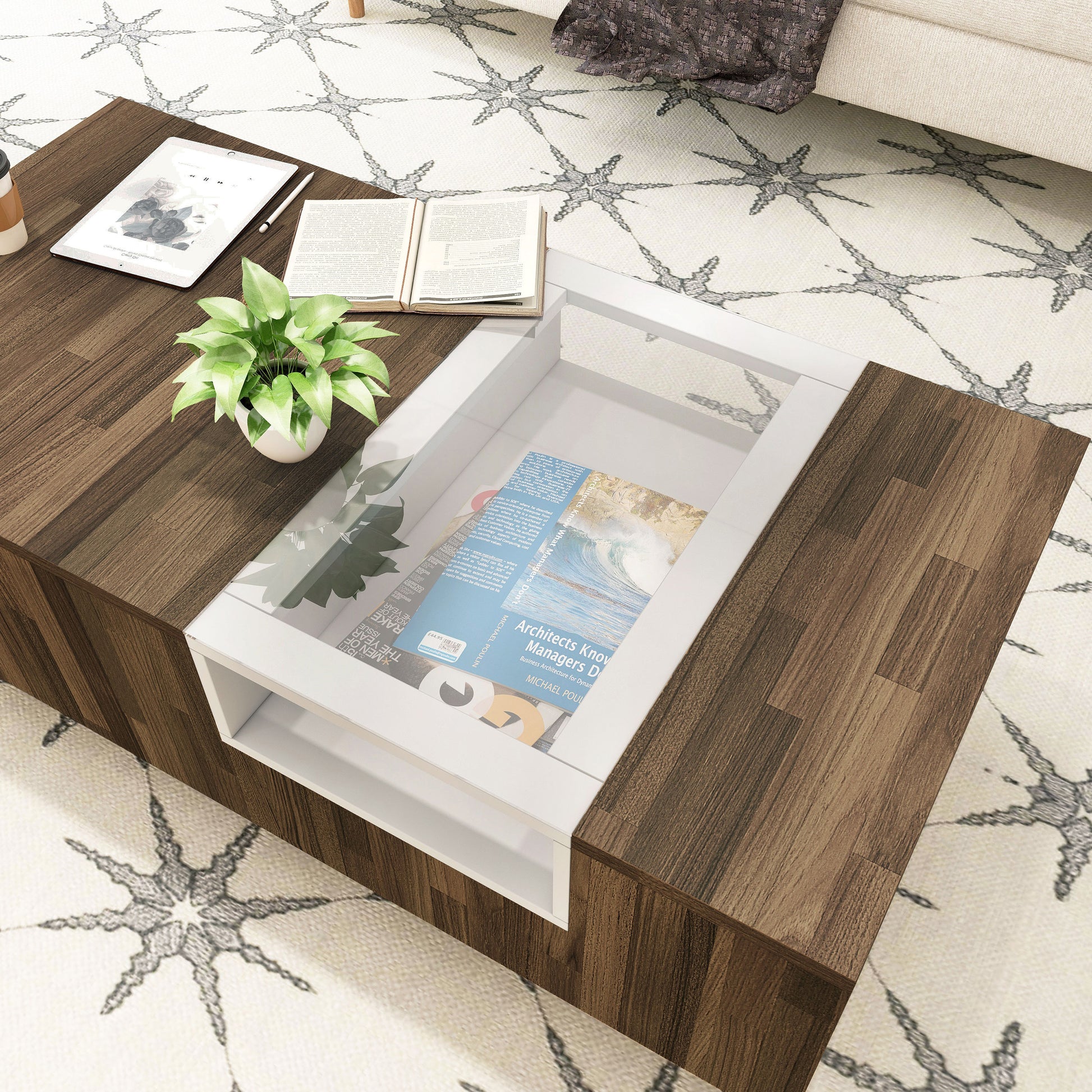 Left angled bird's eye close-up view of a modern light hickory and white three-shelf coffee table in a living room with accessories