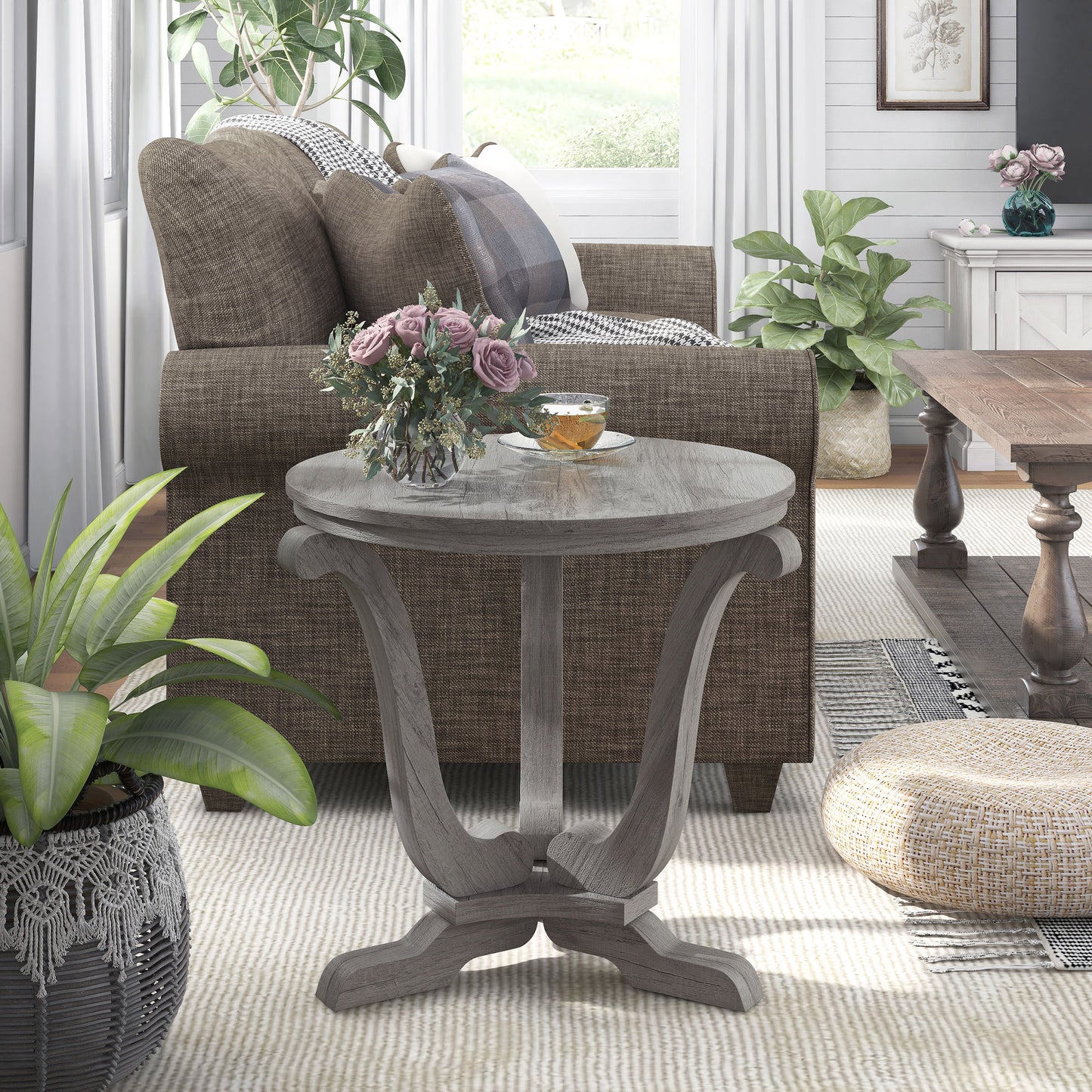 Front-facing single farmhouse vintage gray oak curved pedestal end table in a living room with accessories