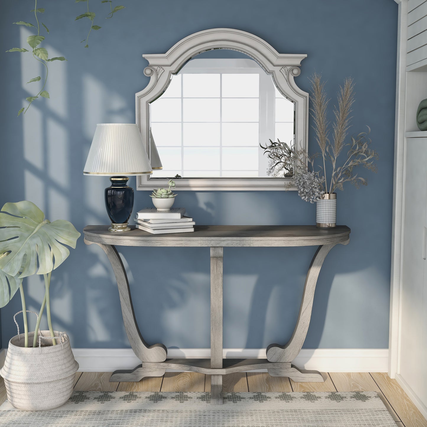 Front-facing farmhouse vintage gray oak curved pedestal console table in a living area with accessories