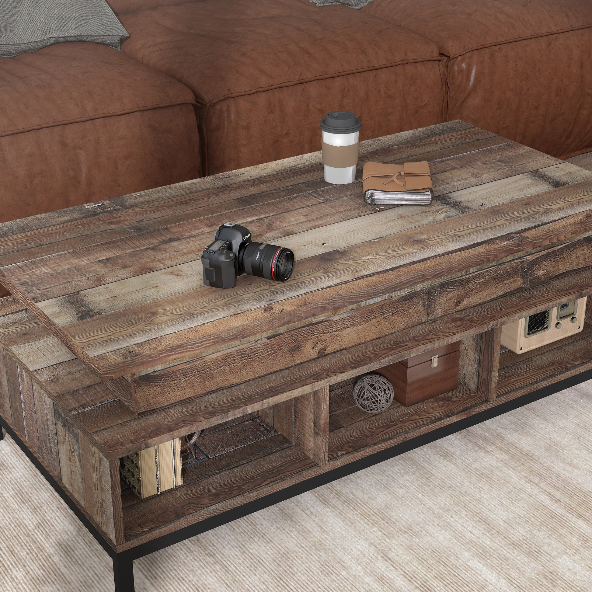 Right angled close-up view of a rustic reclaimed barnwood lift-top tiered coffee table with storage in a living room with accessories