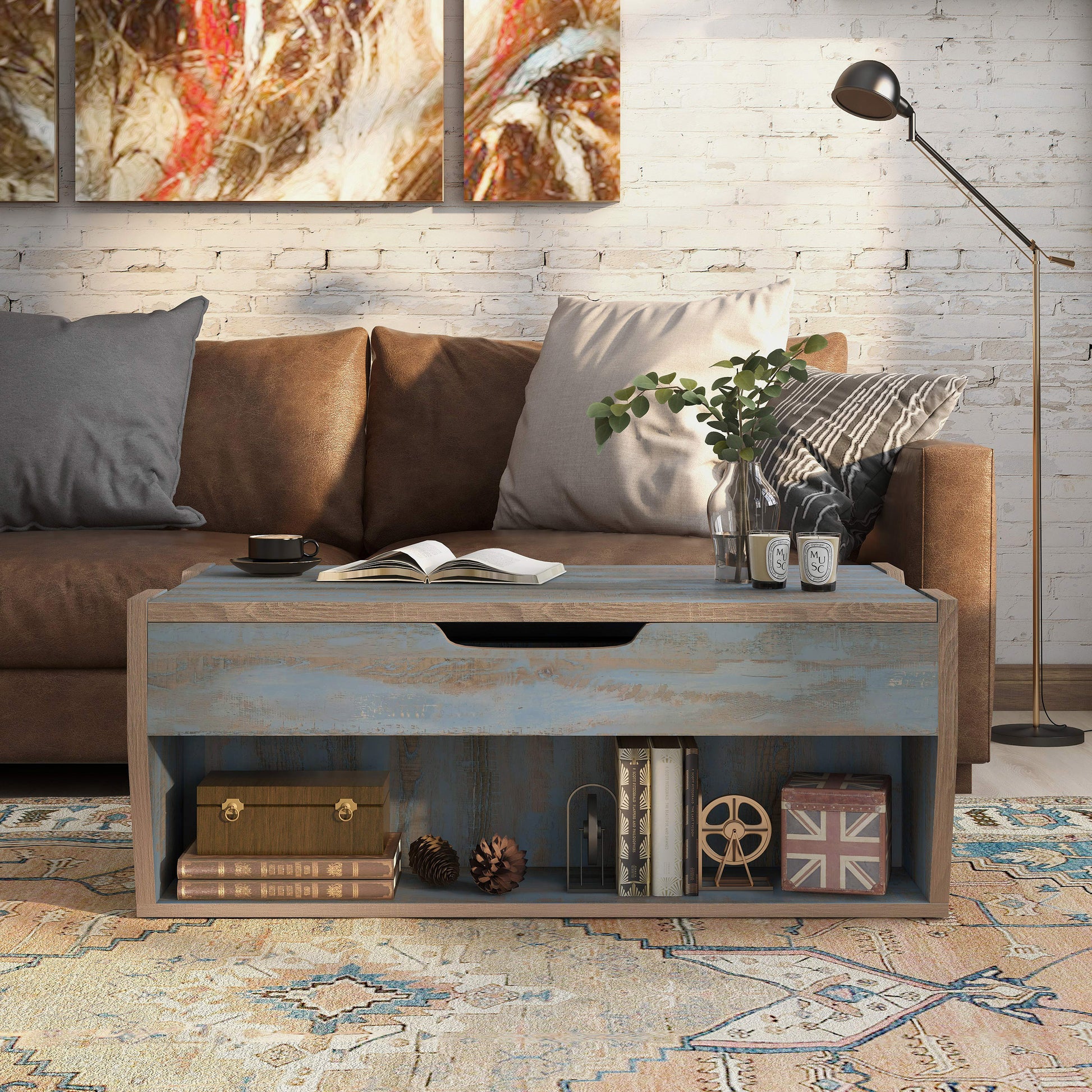 Front-facing rustic distressed blue lift-top storage coffee table in a living room with accessories