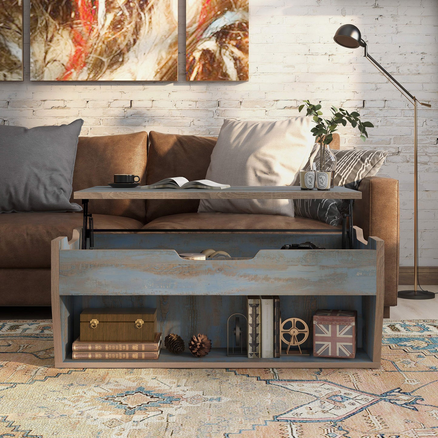 Front-facing rustic distressed blue lift-top storage coffee table with top up in a living room with accessories