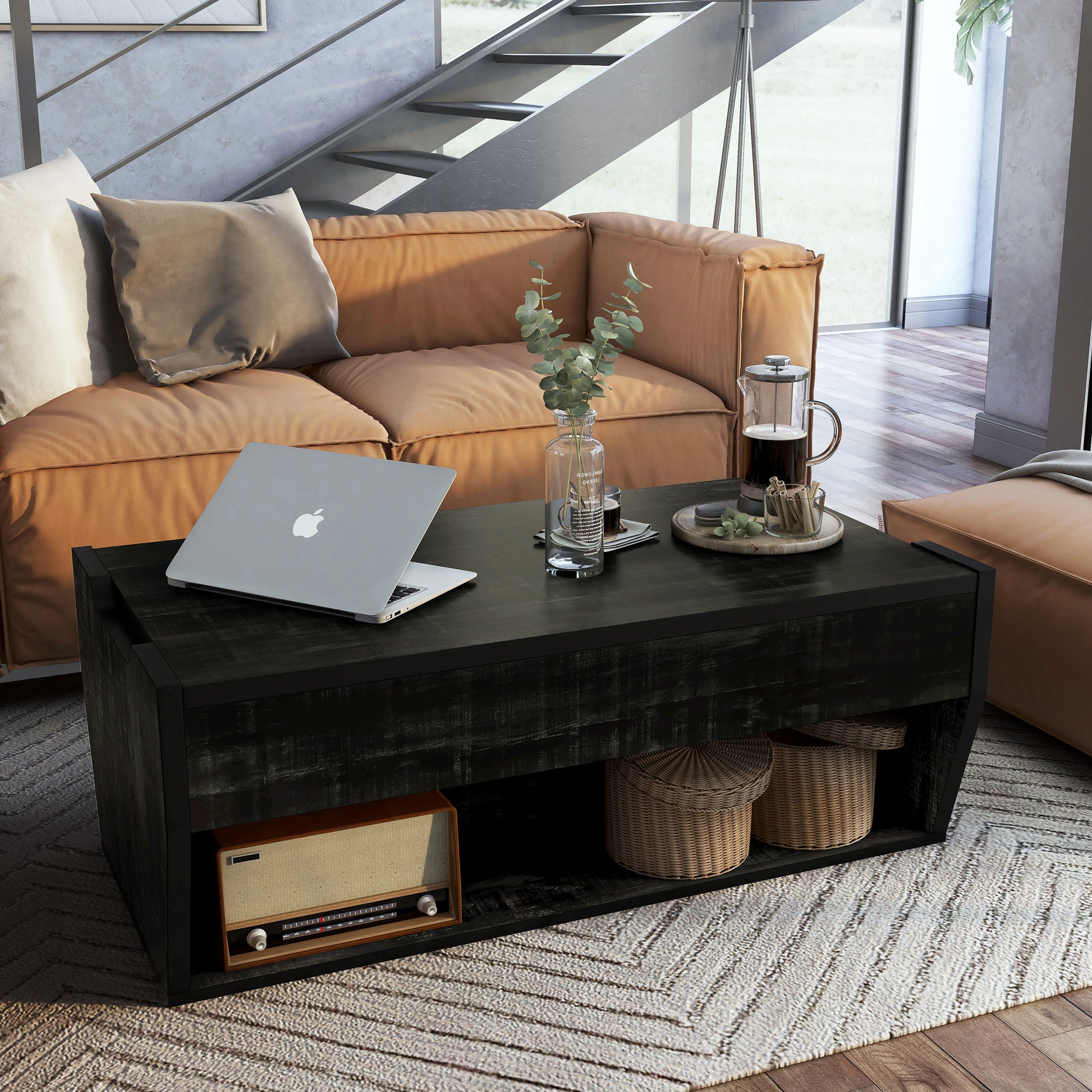 Right angled rustic reclaimed black lift-top storage coffee table in a living room with accessories