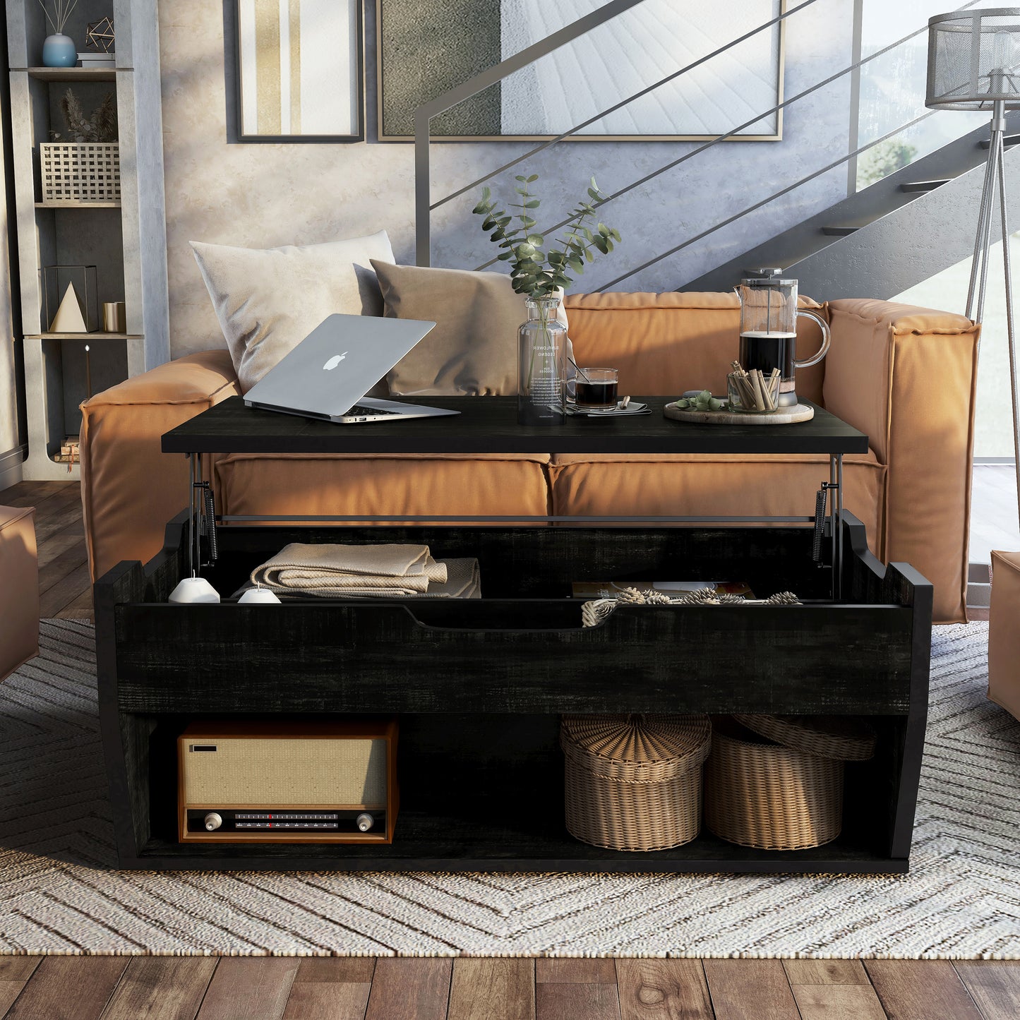 Front-facing rustic reclaimed black lift-top storage coffee table with top up in a living room with accessories