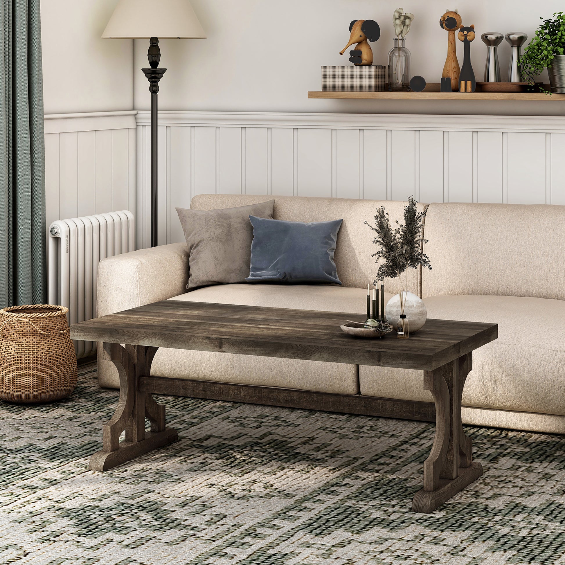 Left angled farmhouse reclaimed oak trestle base coffee table in a living room with accessories
