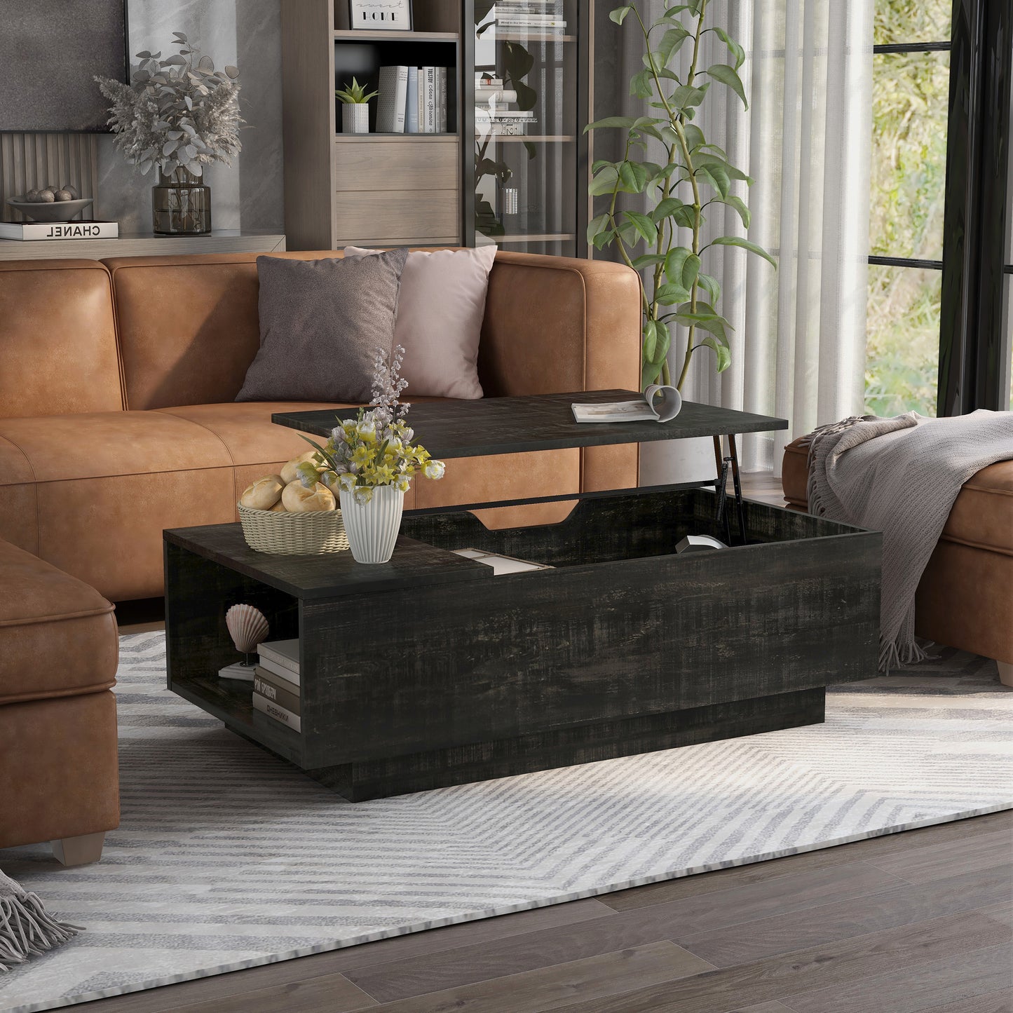 Right angled rustic reclaimed black lift-top storage chest coffee table with top up in a living room with accessories