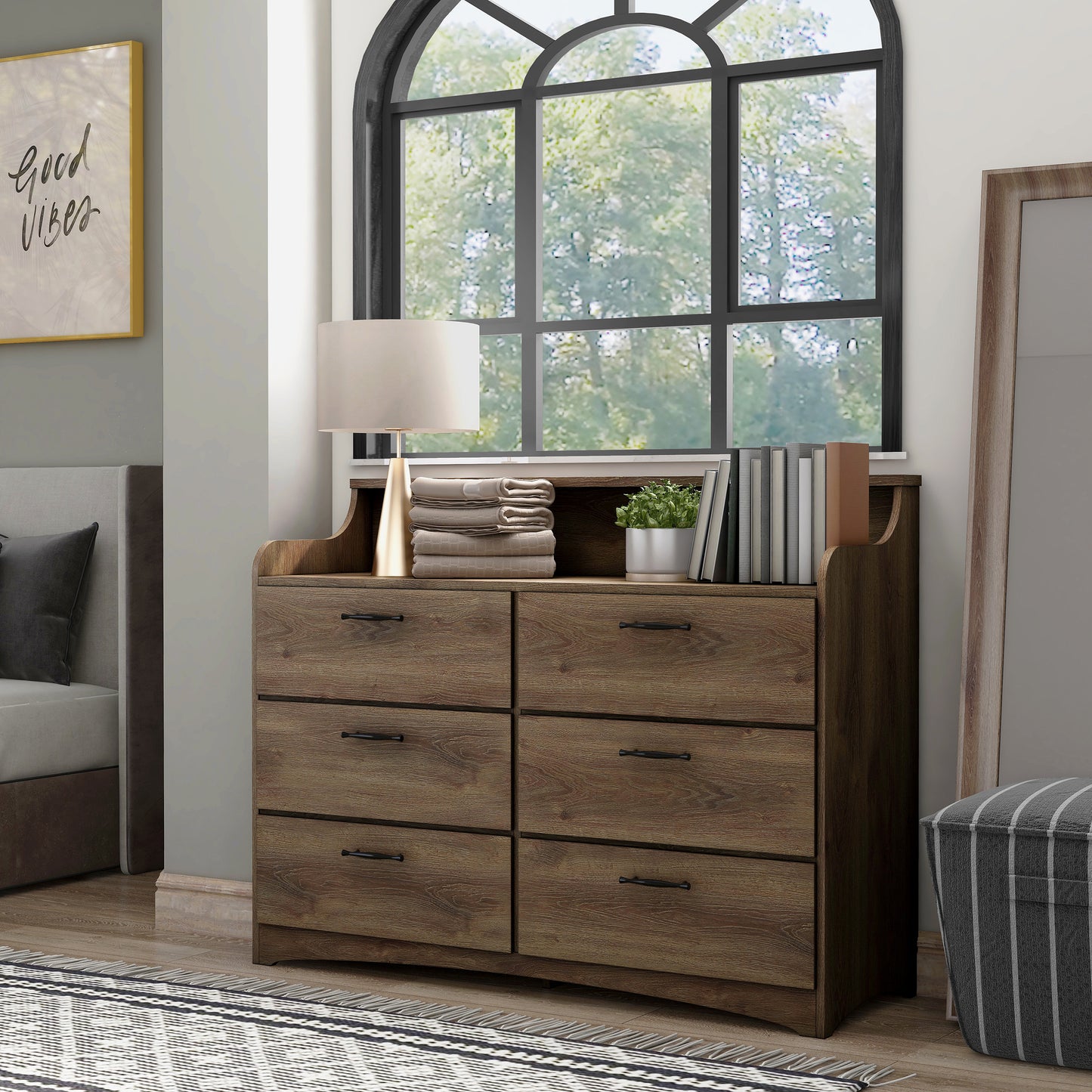 Left angled transitional distressed walnut six-drawer double dresser with a tiered top in a bedroom with accessories