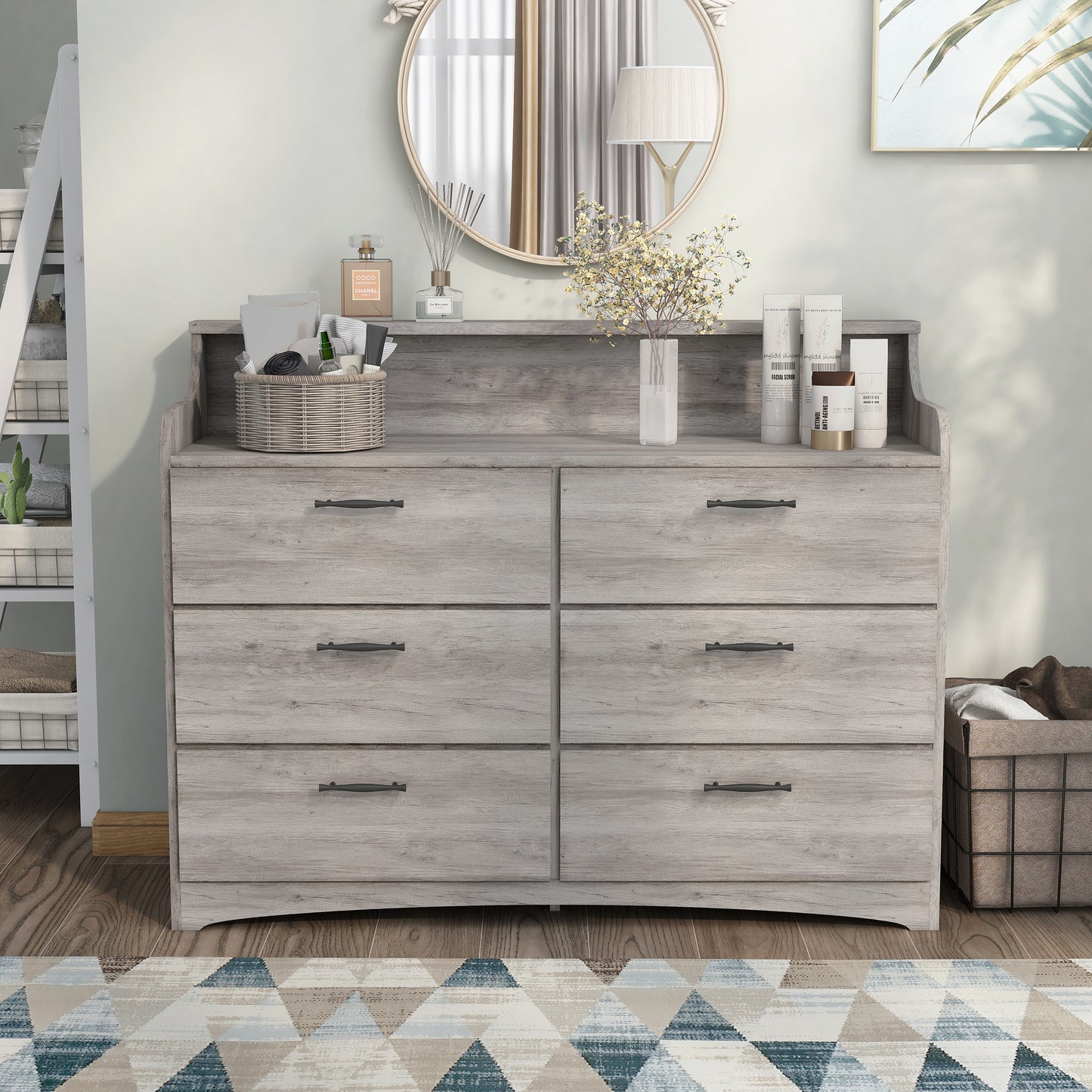 Front-facing transitional coastal white six-drawer double dresser with a tiered top in a bedroom with accessories