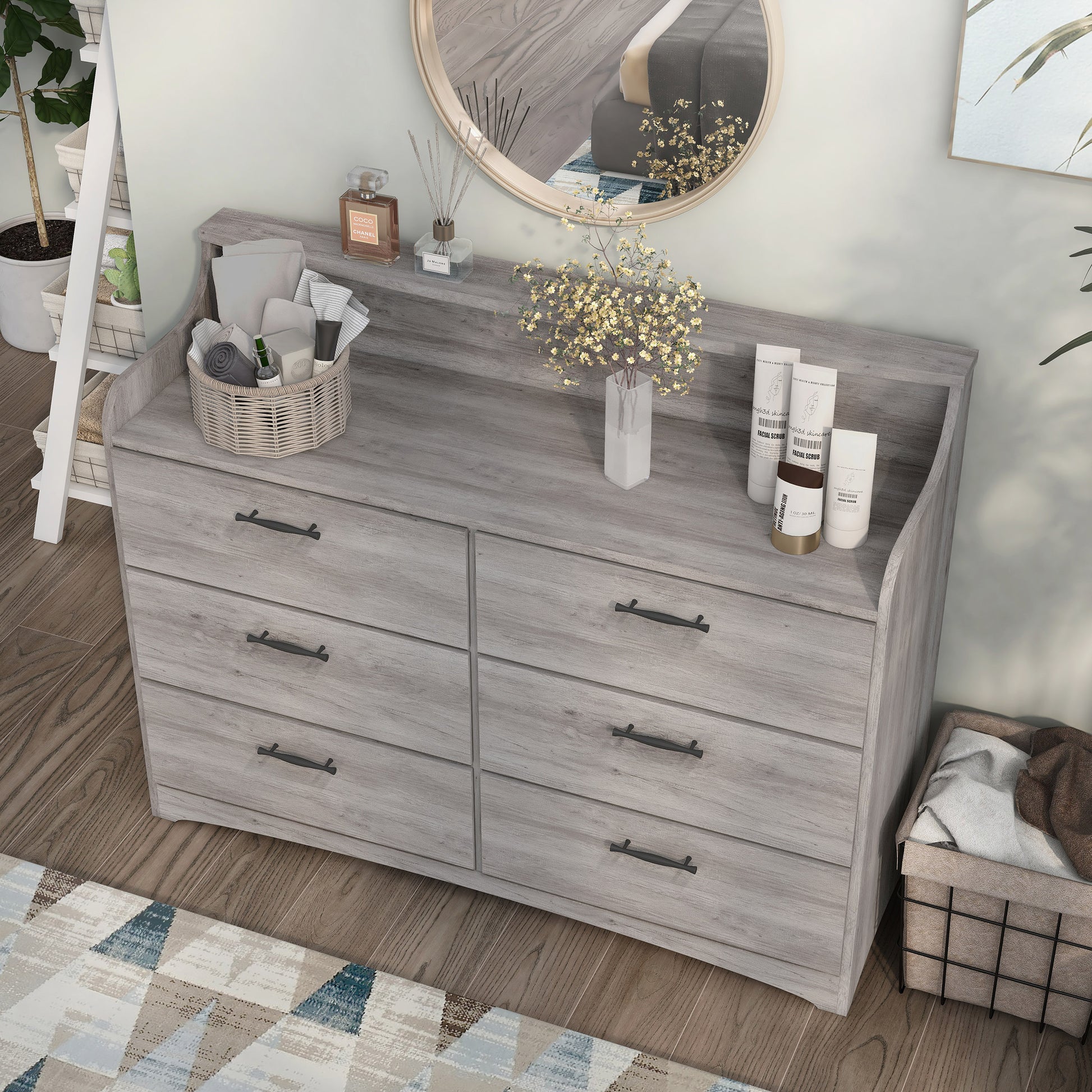 Left angled bird's eye view of a transitional coastal white six-drawer double dresser with a tiered top in a bedroom with accessories