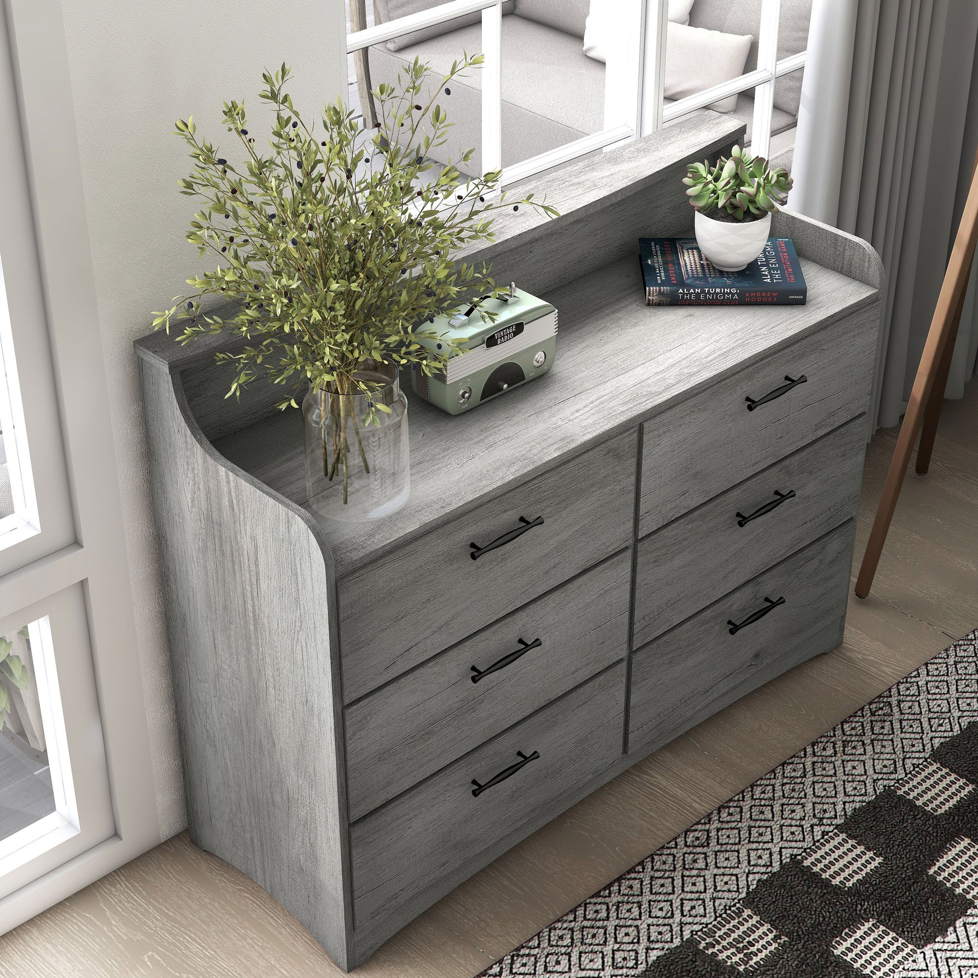 Right angled bird's eye view of a transitional vintage gray oak six-drawer double dresser with a tiered top in a bedroom with accessories