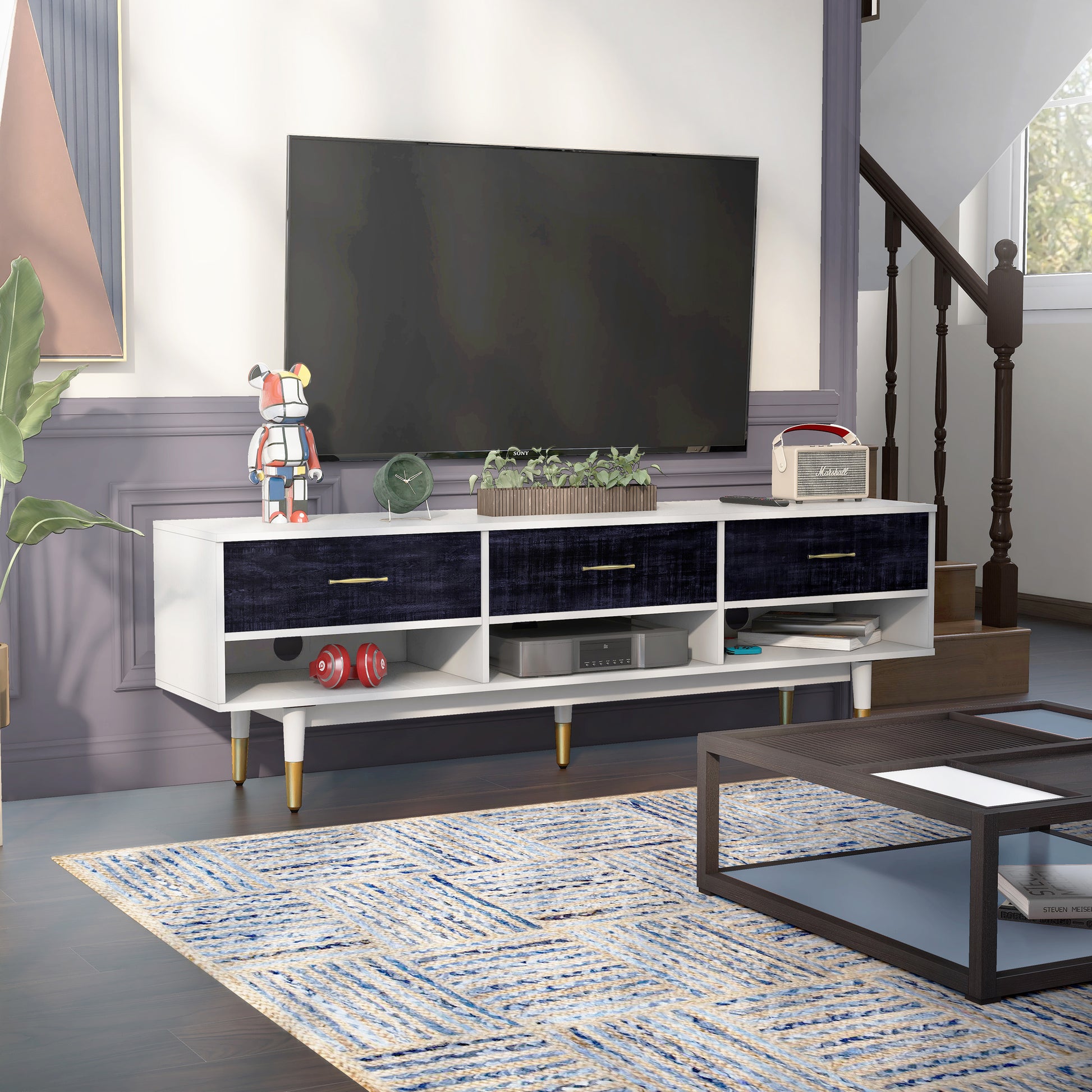 Right angled mid-century modern rustic navy blue and white three-shelf three-drawer TV stand in a living area with accessories