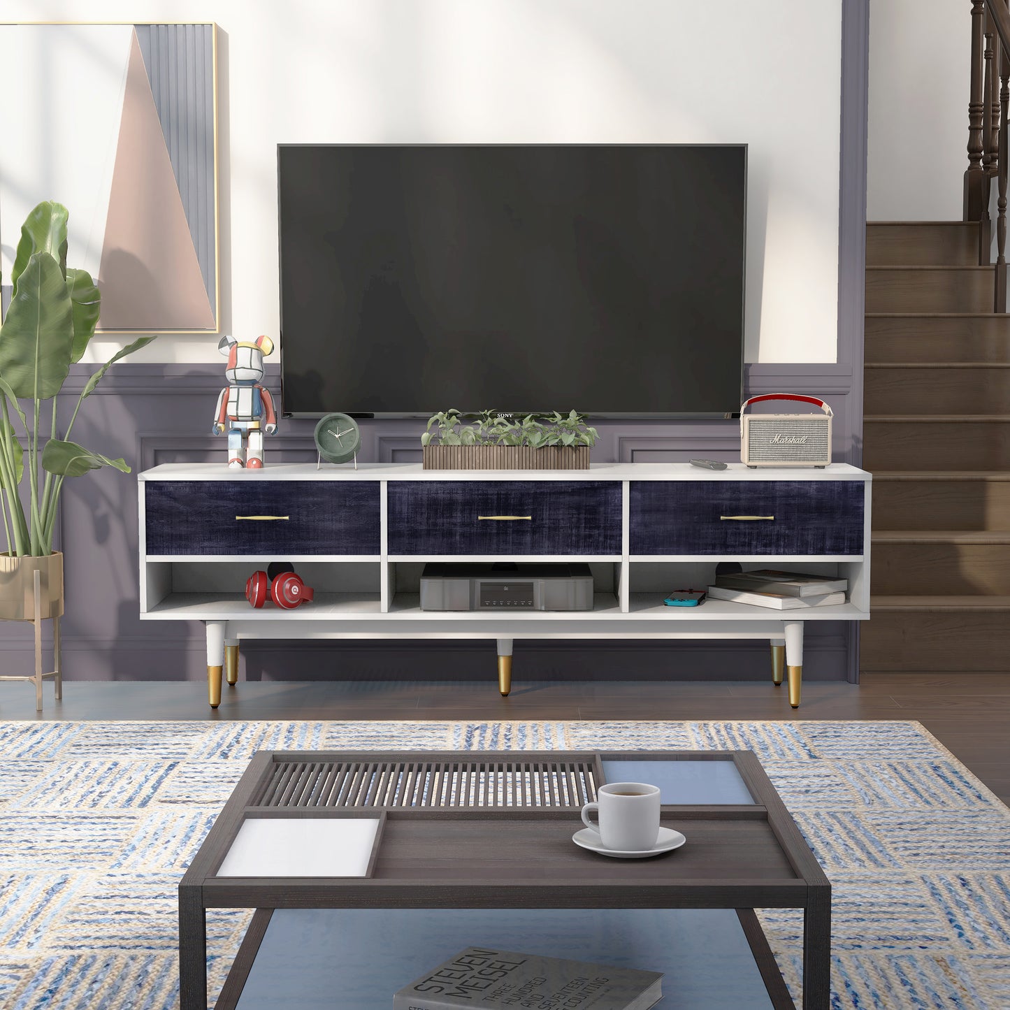 Front-facing mid-century modern rustic navy blue and white three-shelf three-drawer TV stand in a living area with accessories