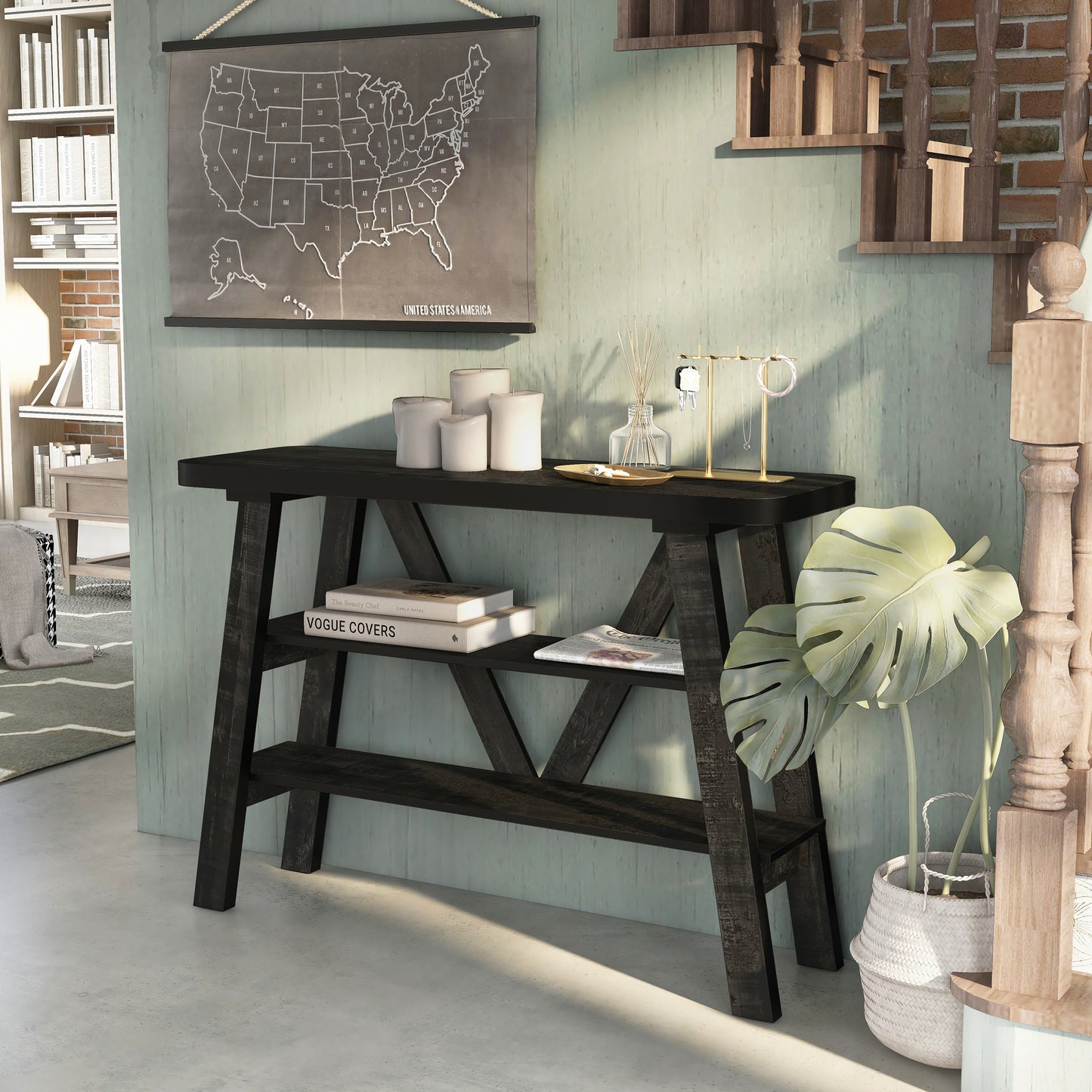 Left angled farmhouse reclaimed black two-shelf console table in a living area with accessories