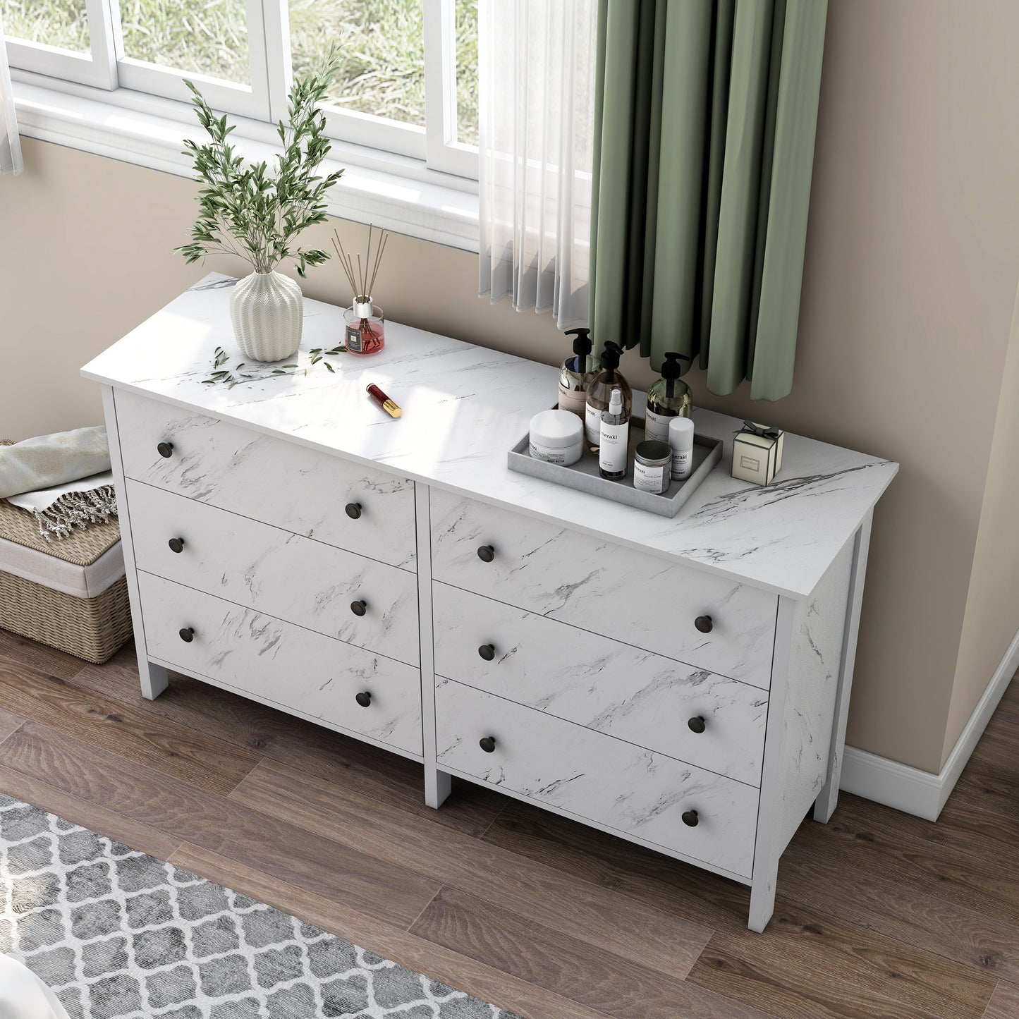 Left angled bird's eye view of a transitional white faux marble six-drawer double dresser in a bedroom with accessories