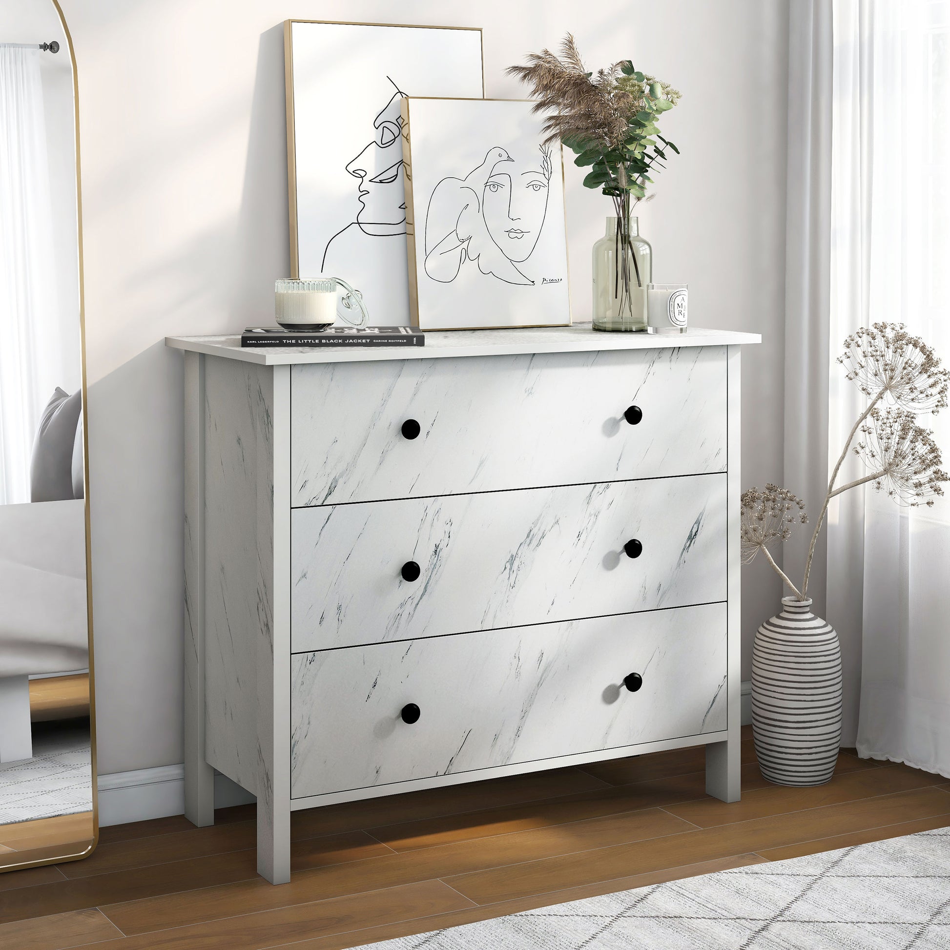 Right angled transitional white faux marble three-drawer youth dresser in a bedroom with accessories
