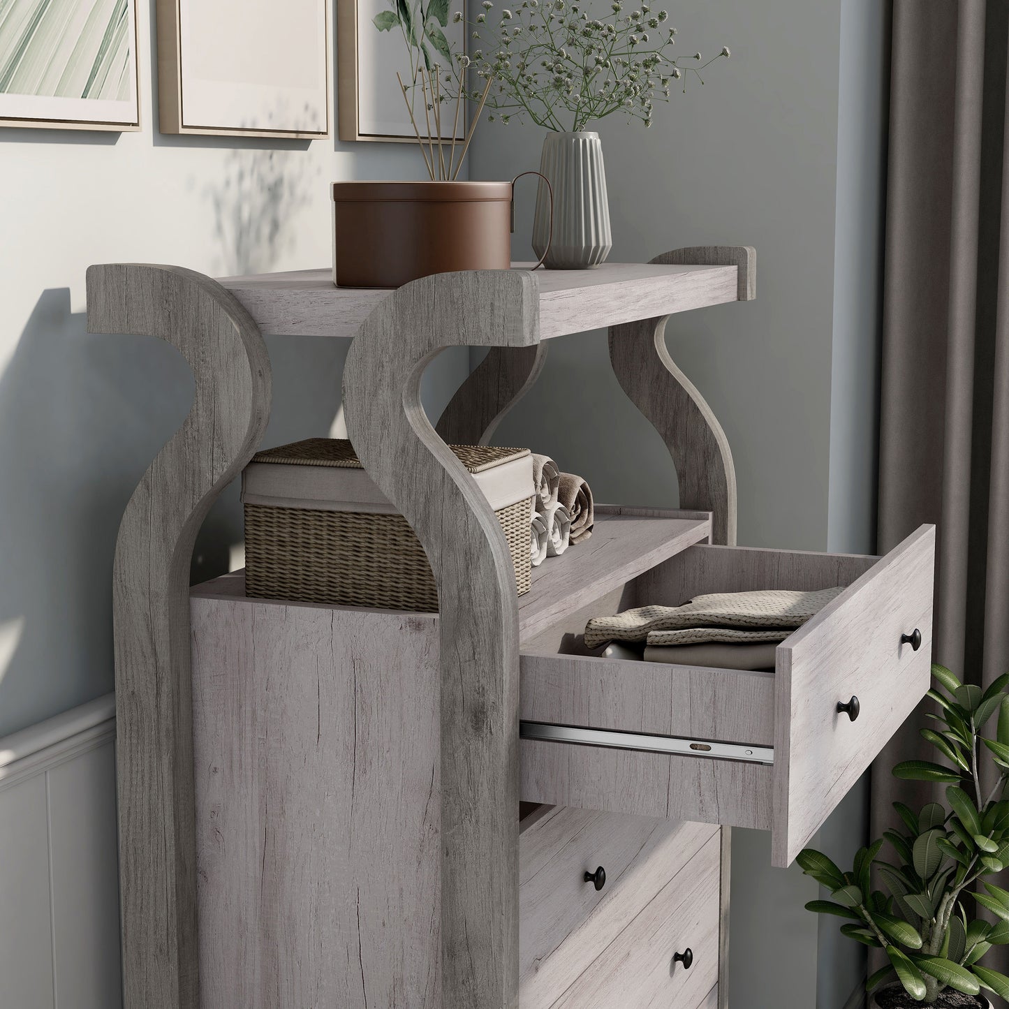 Right angled close-up view of a transitional coastal white four-drawer tall dresser with a shelf and top drawer open in a bedroom with accessories