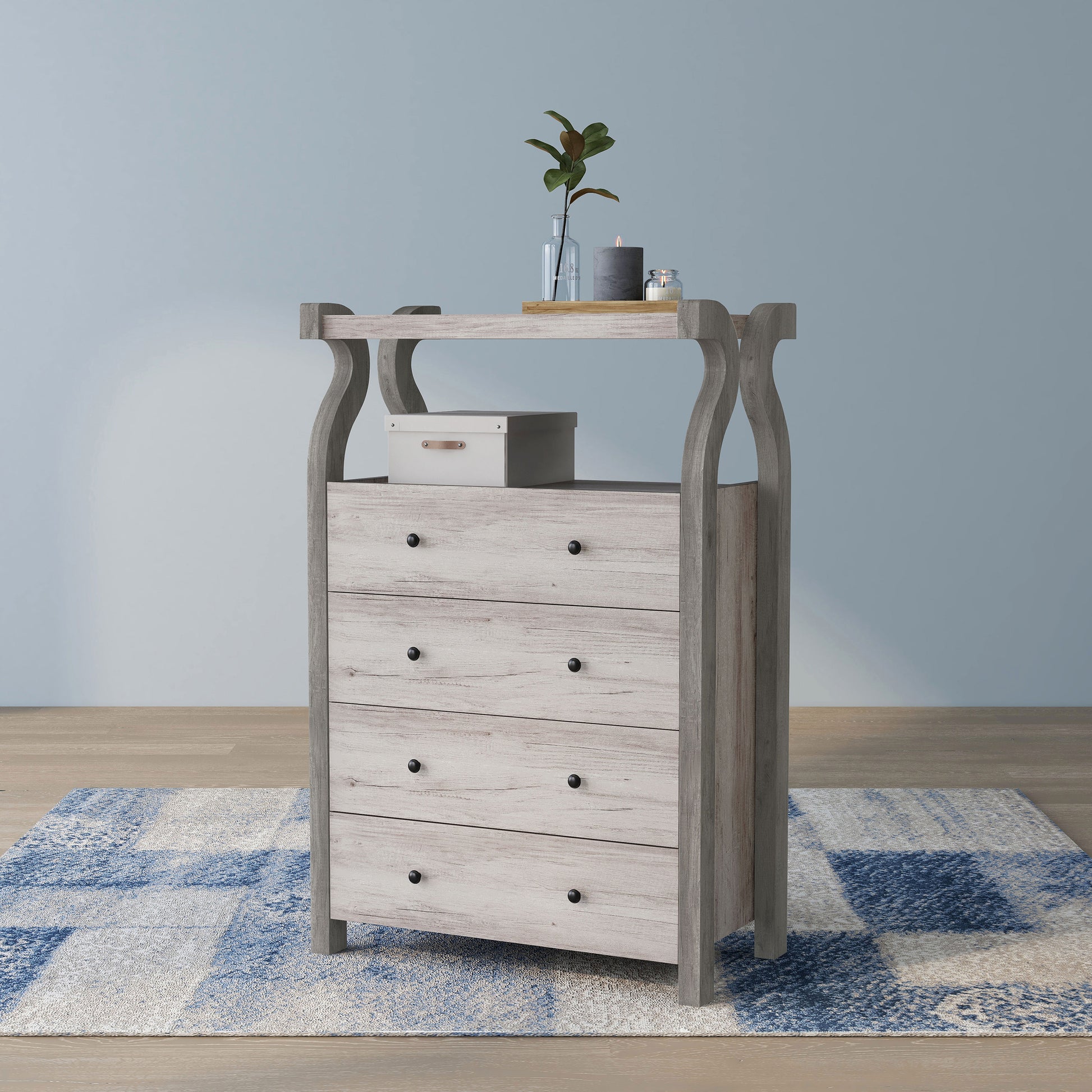 Left angled transitional coastal white four-drawer tall dresser with a shelf on an area rug with accessories