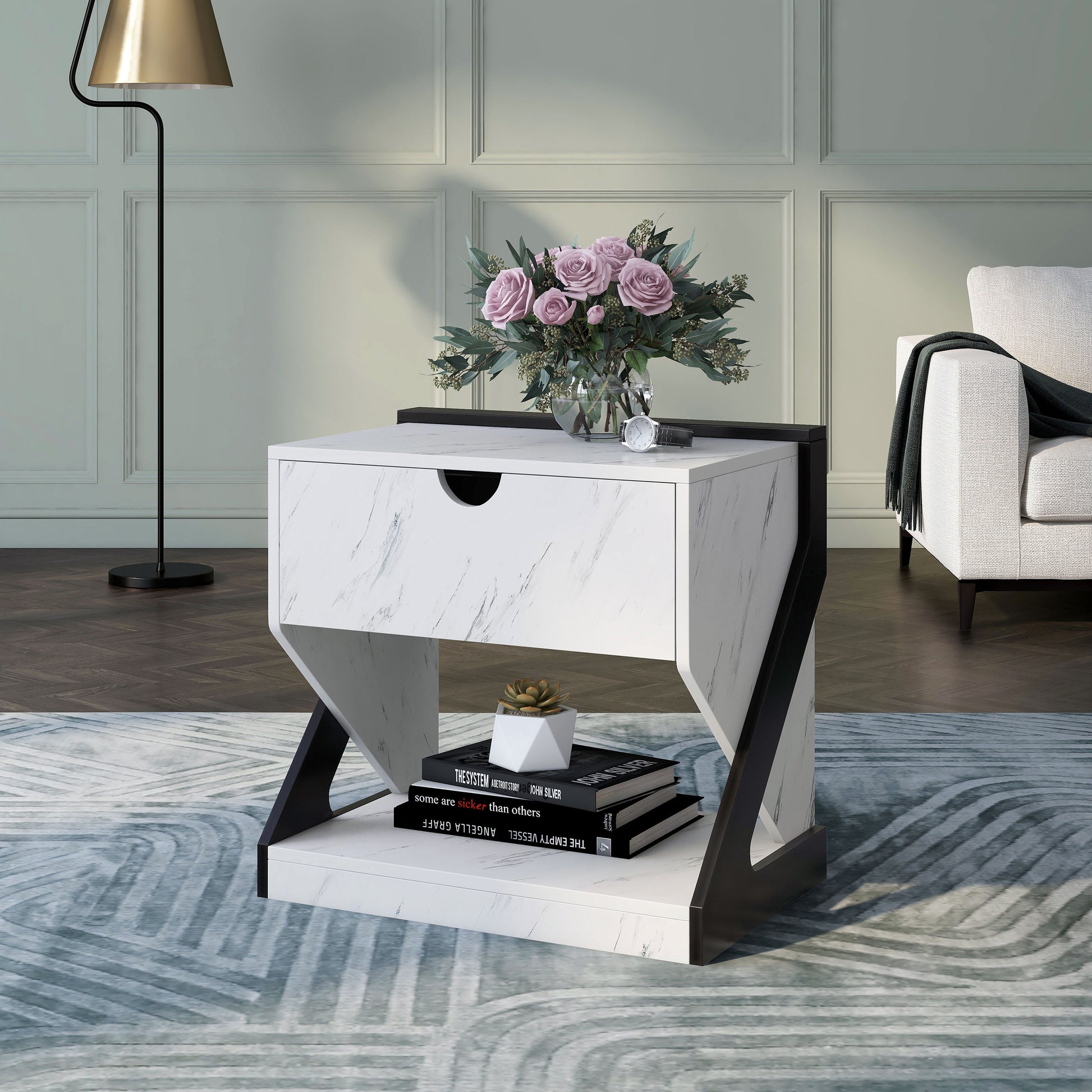 Left angled contemporary white faux marble one-drawer nightstand side table in a living room with accessories