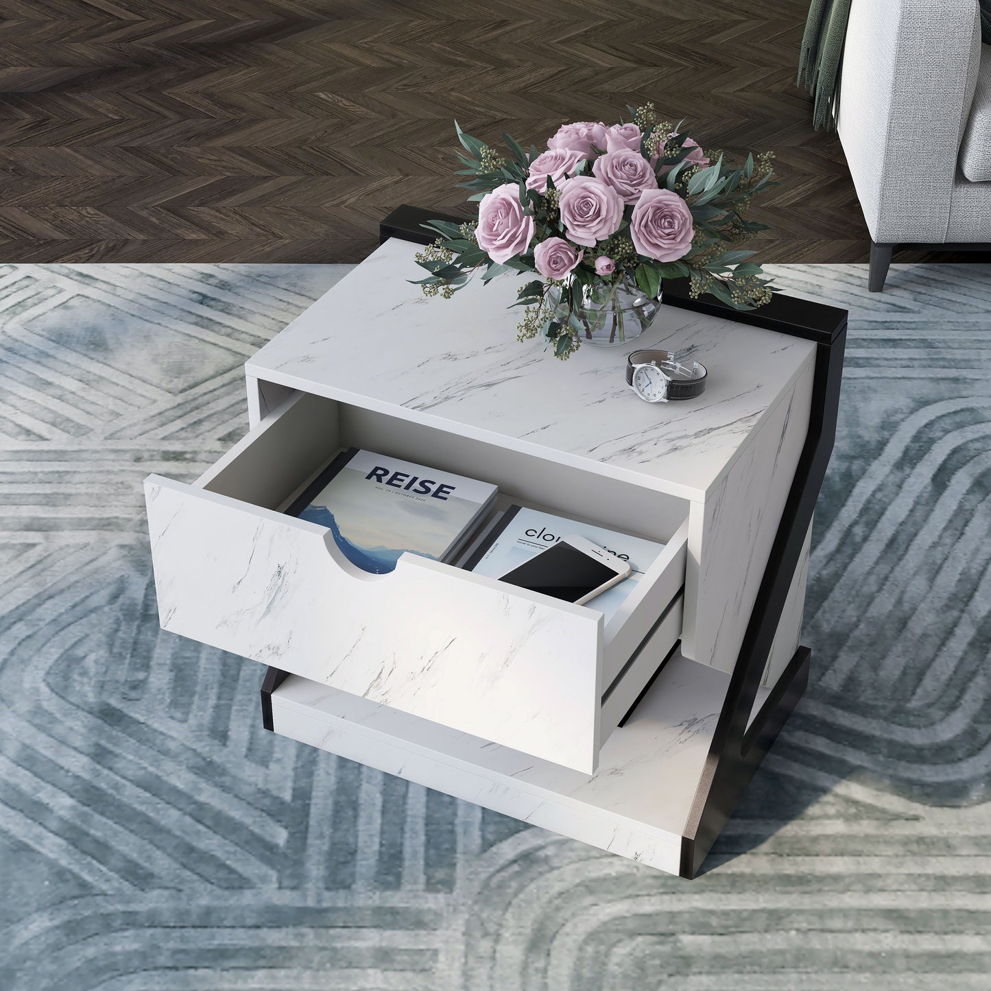 Left angled bird's eye view of a contemporary white faux marble one-drawer nightstand side table with drawer open in a living room with accessories