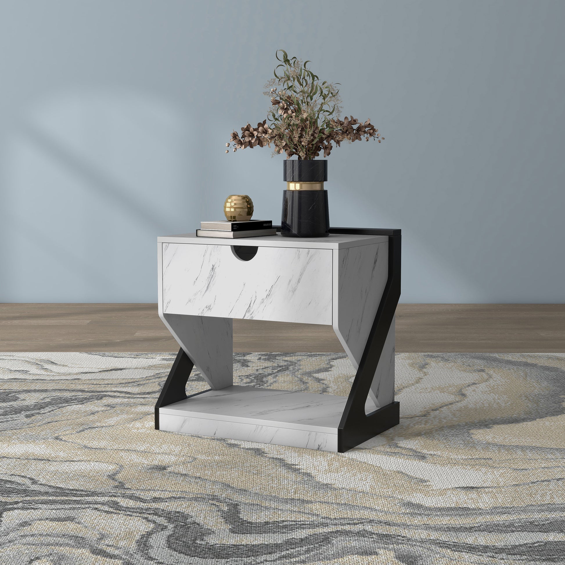 Left angled contemporary white faux marble one-drawer nightstand side table on an area rug with accessories