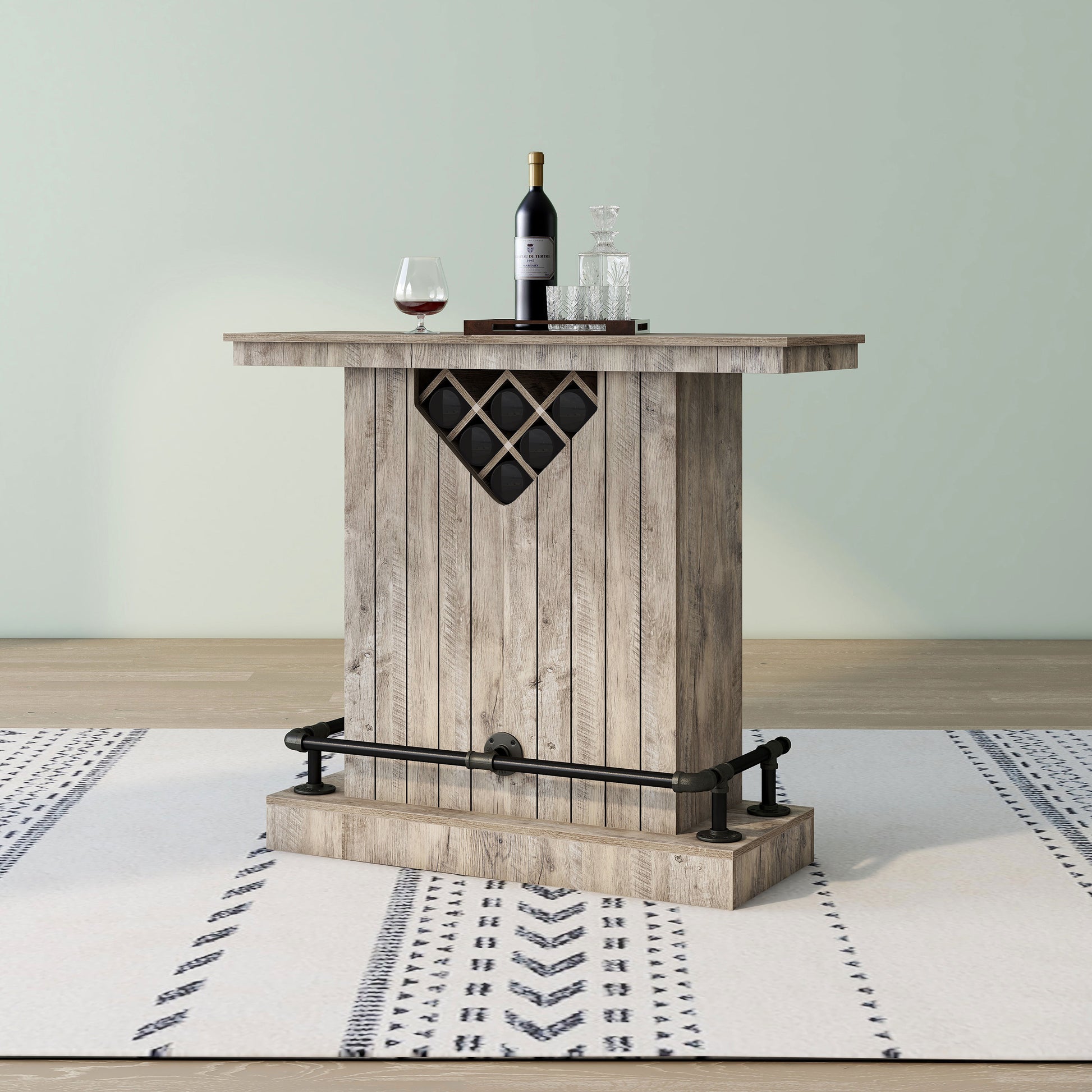 Left angled back view of a farmhouse weathered oak eight-bottle home bar with a footrest on an area rug