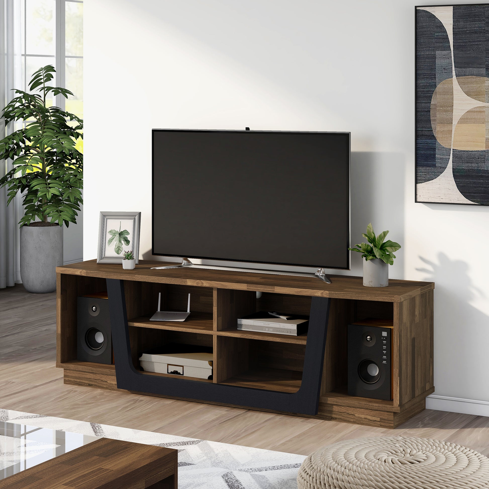 Left angled contemporary light hickory and black six-shelf TV stand in a living room with accessories