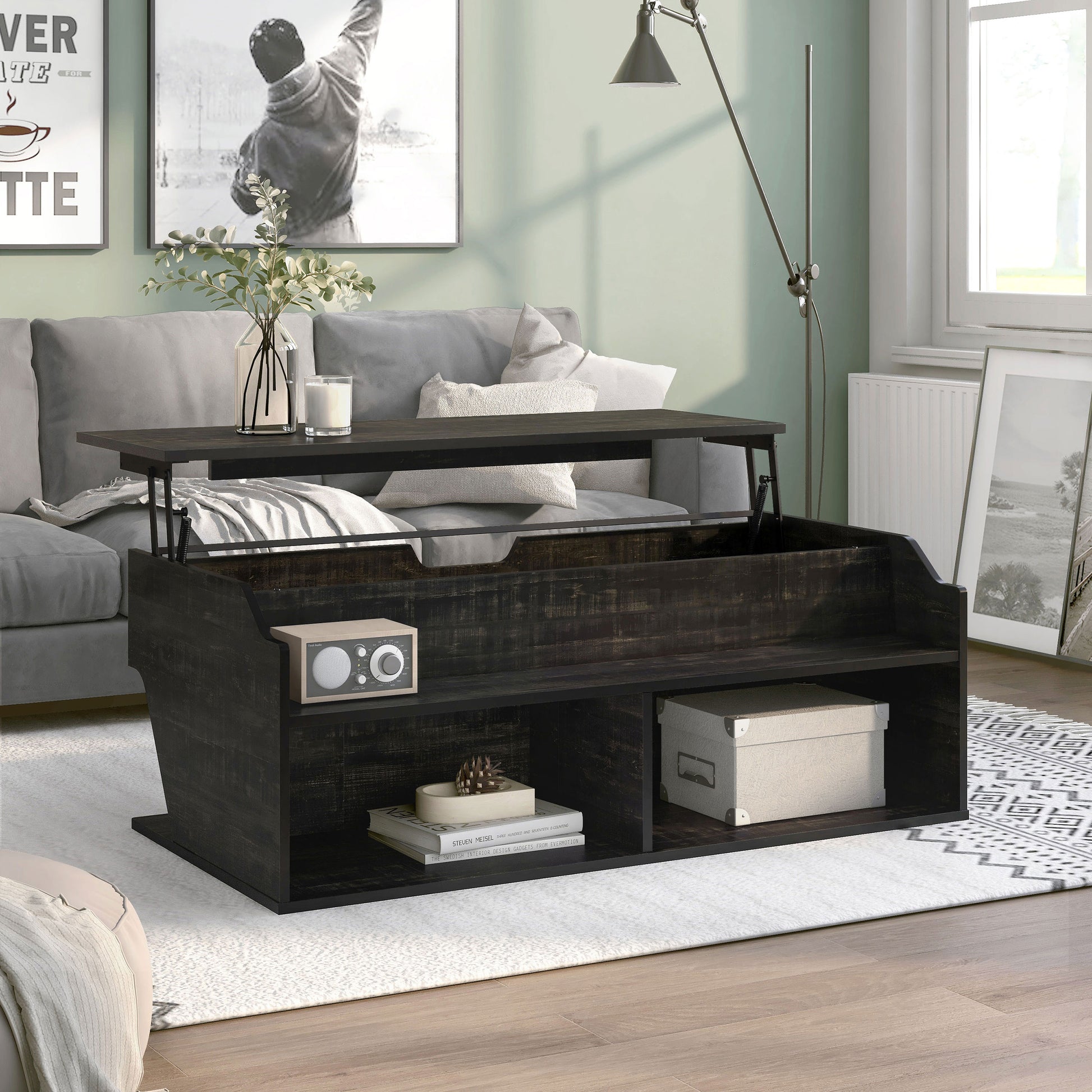 Right angled transitional reclaimed black oak lift-top coffee table with storage and top raised in a living room with accessories