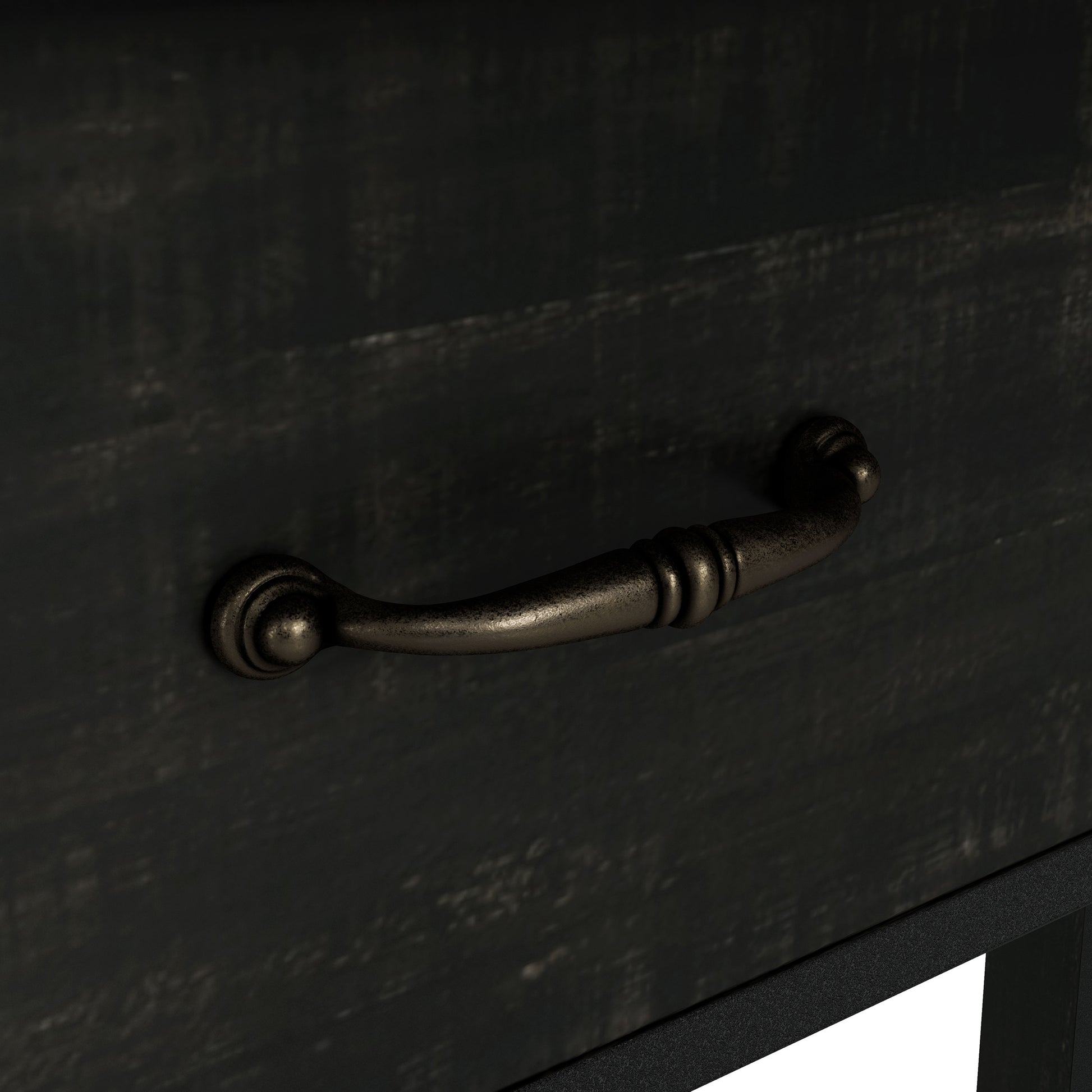 Right angled drawer pull close-up view of a farmhouse reclaimed black oak three-shelf storage console table with a drawer on a white background