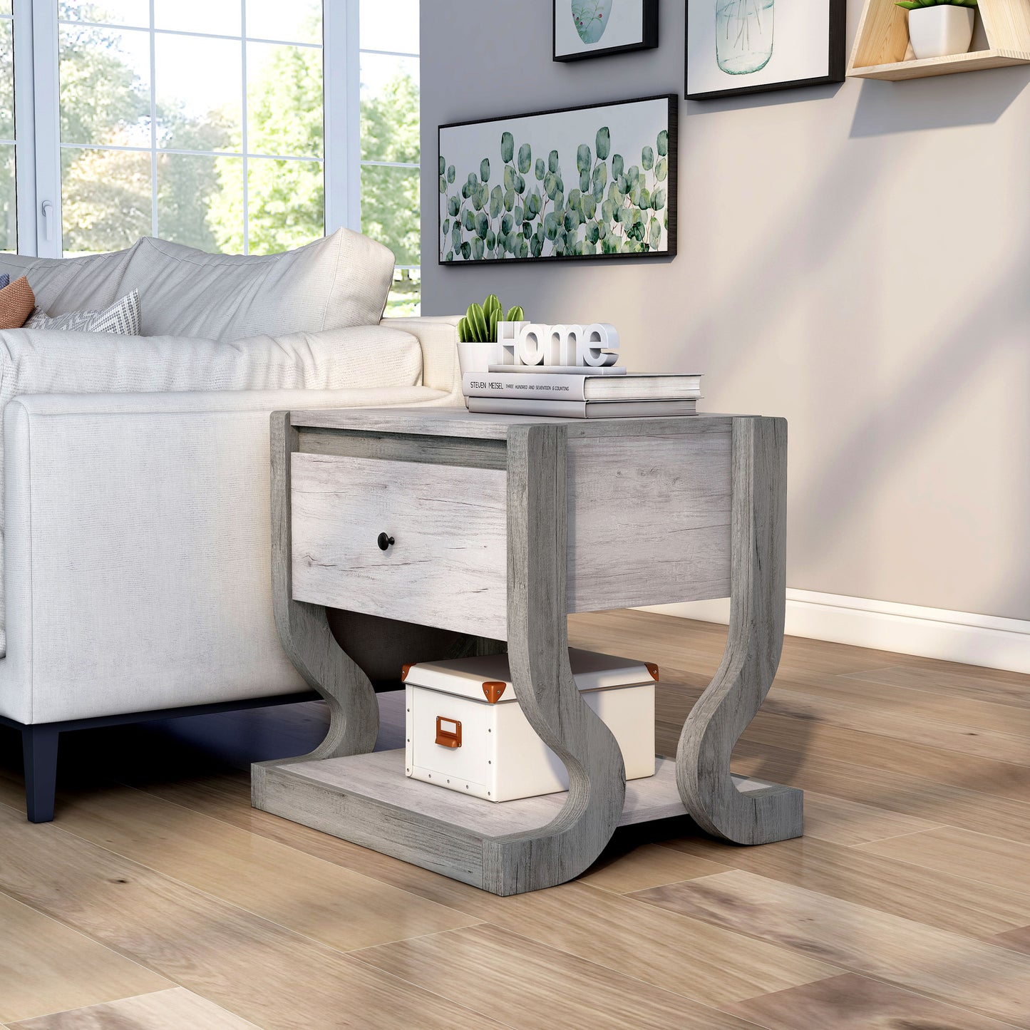 Left angled transitional coastal white one-drawer side table with a shelf in a living room with accessories