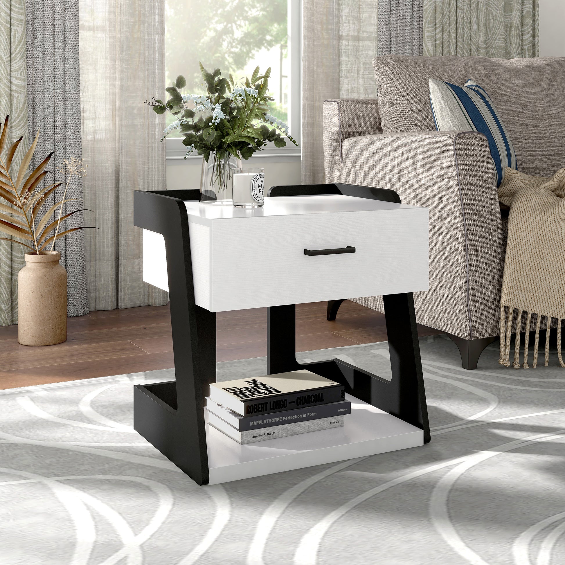 Right angled contemporary white and black one-drawer side table with a shelf in a living room with accessories